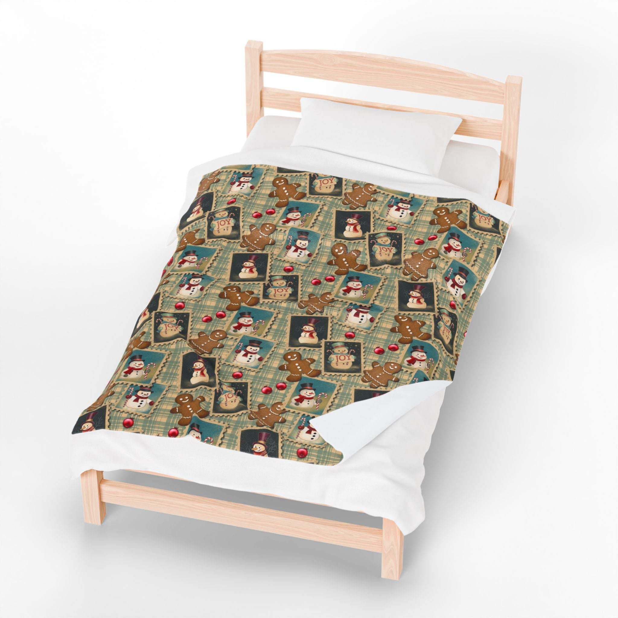Plush blanket with retro Christmas watercolor design on a wooden bed