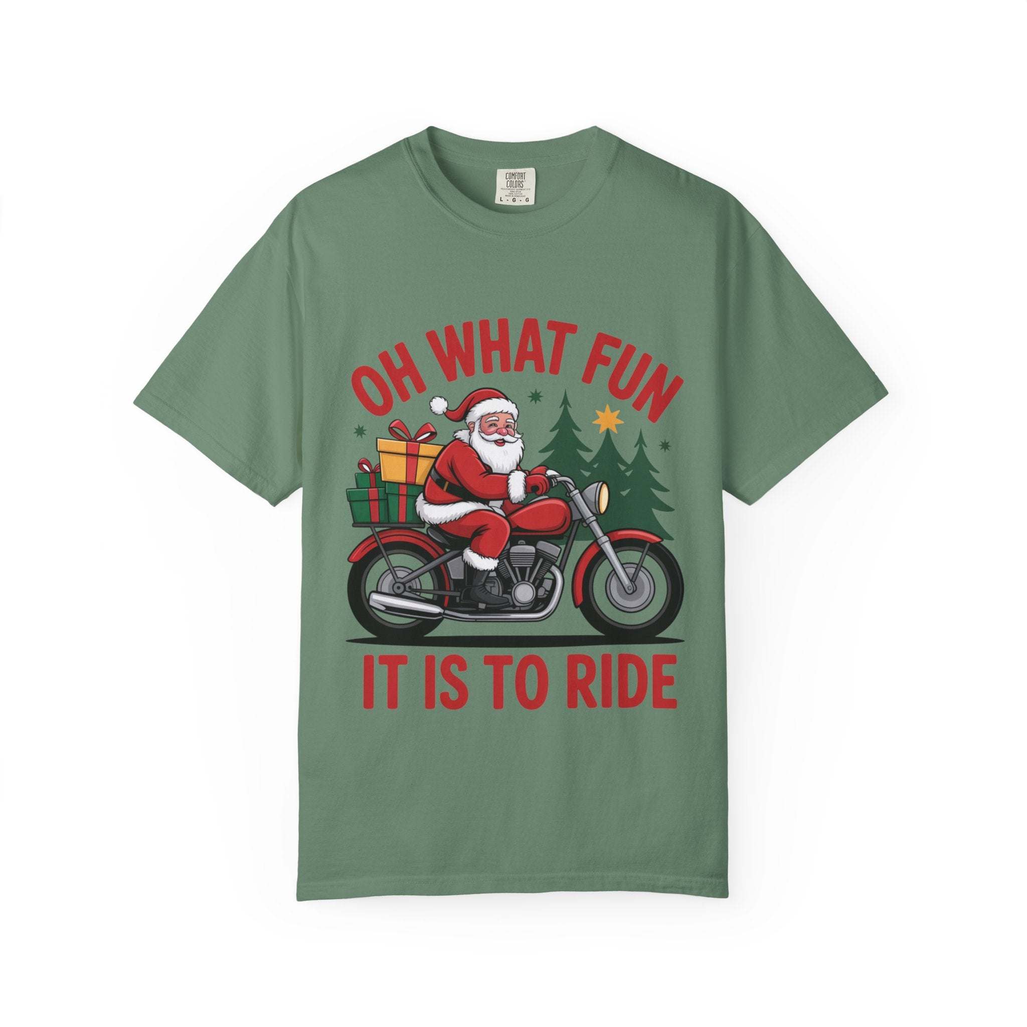 Santa on a motorcycle graphic on green festive Christmas t-shirt with gifts and trees