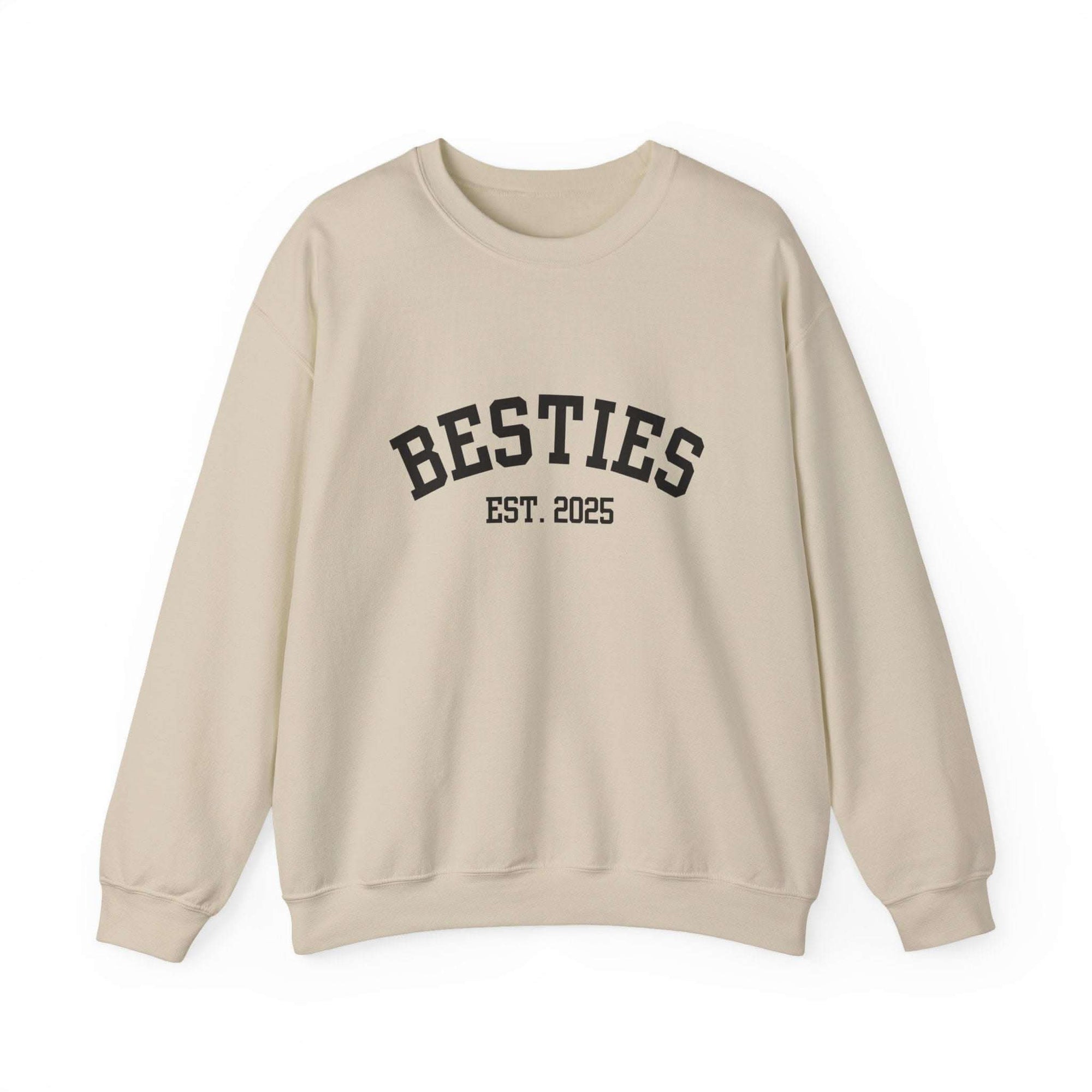 Beige sweatshirt with 'BESTIES EST. 2025' text on a white background