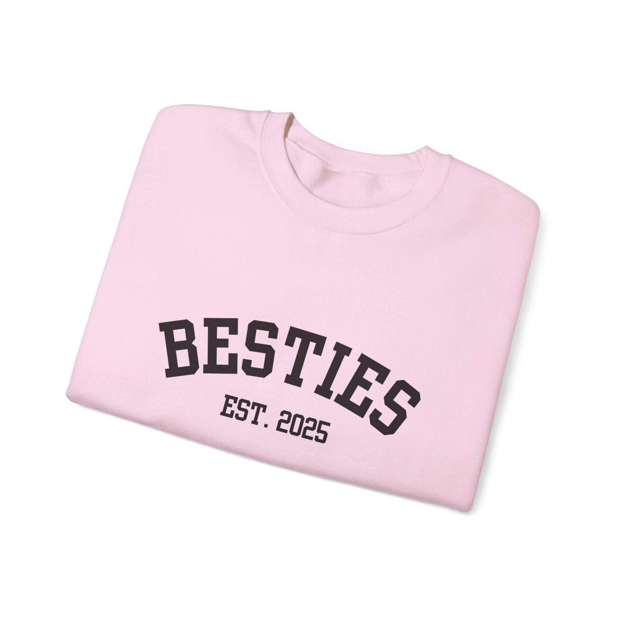 Pink Varsity Besties Crewneck Sweatshirt with BESTIES EST. 2025 lettering, cotton blend fabric, and classic crew neckline.