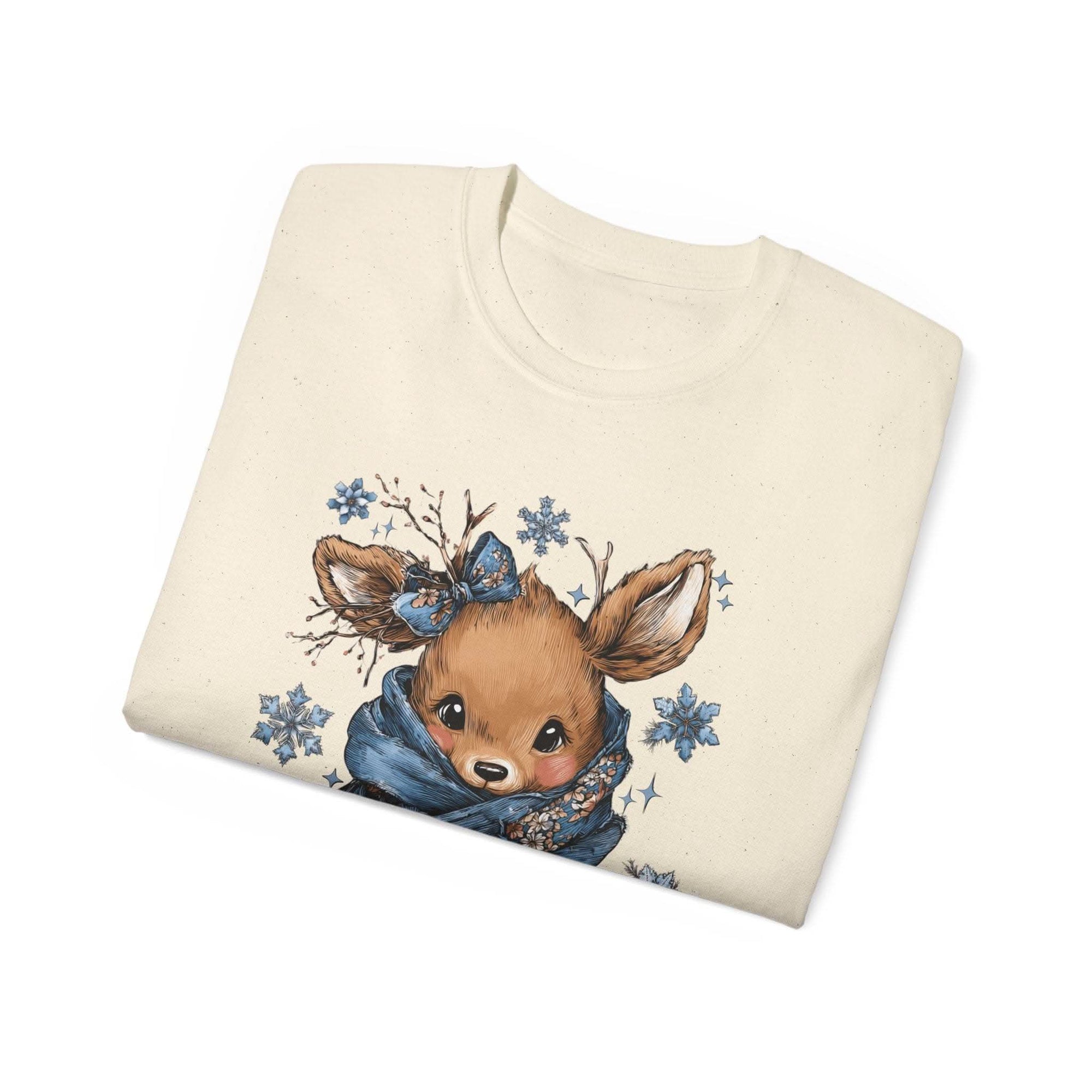 White t-shirt with retro patchwork reindeer design wearing blue scarf and surrounded by snowflakes