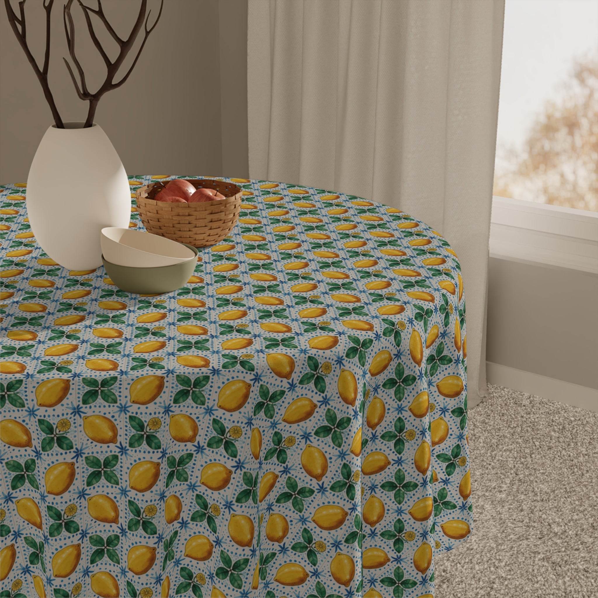 Mediterranean Lemon tablecloth with vibrant lemon and leaf pattern on round dining table