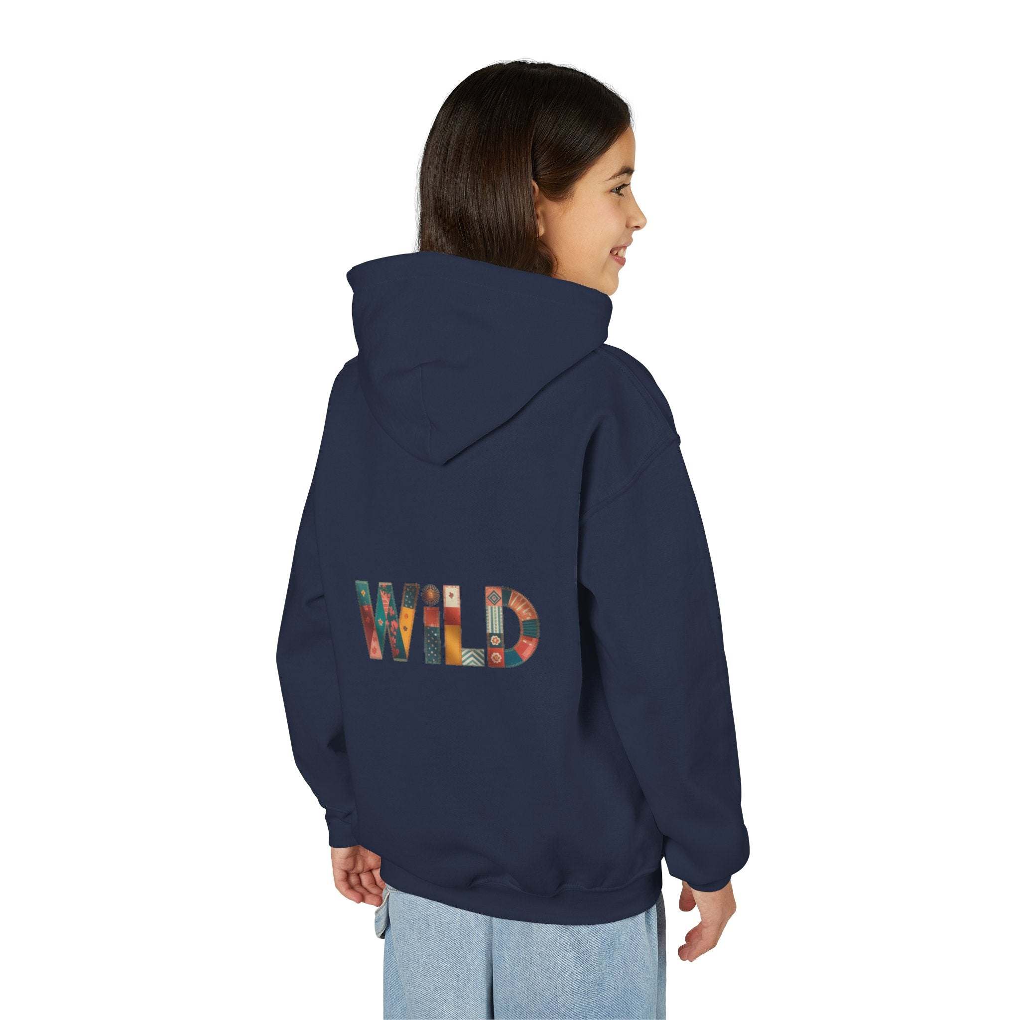 Child wearing navy Patchwork Wild Word Hoodie with colorful "WILD" text on back and kangaroo pouch pocket