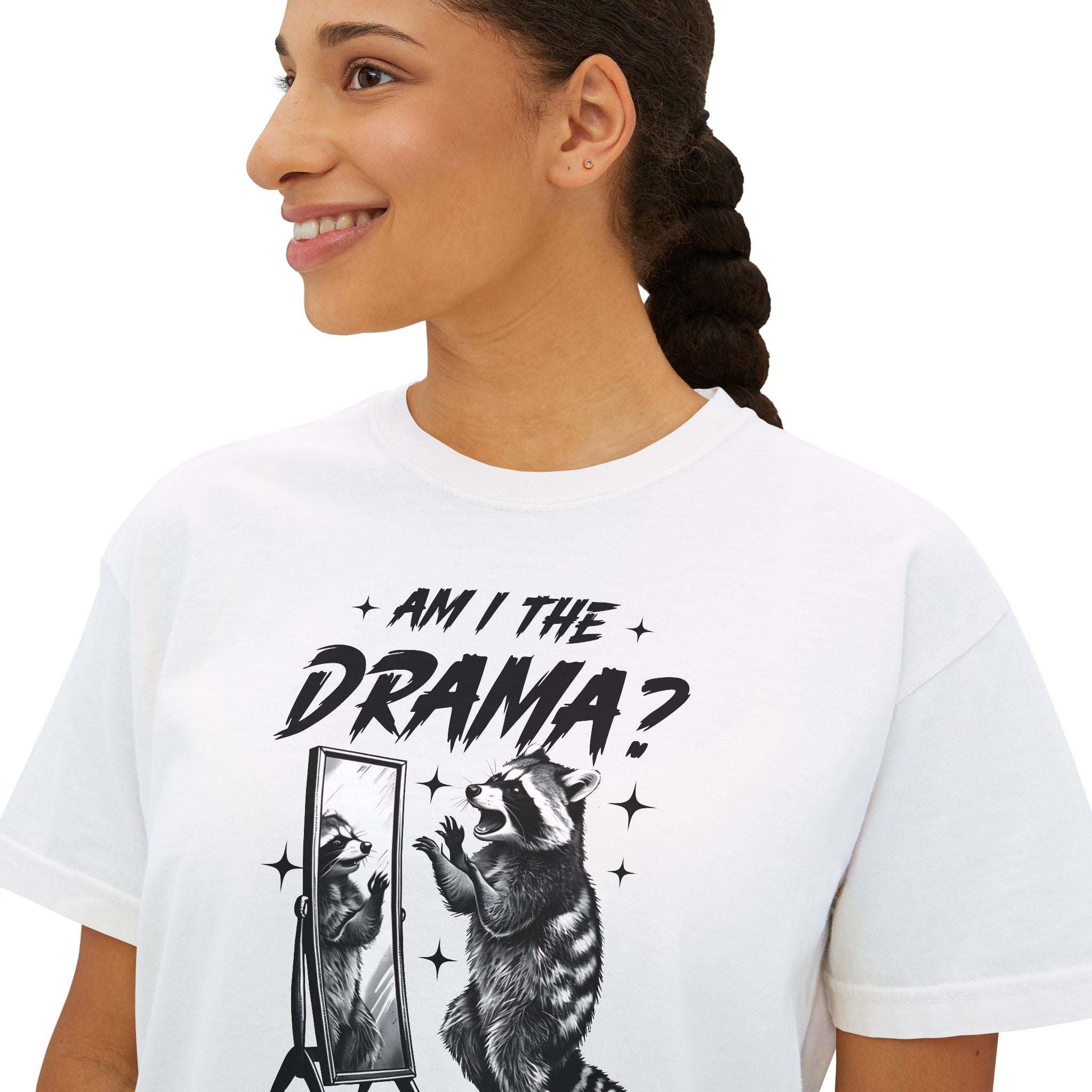 Woman wearing white Boxy Tee with "Am I The Drama?" text and raccoon graphic on front