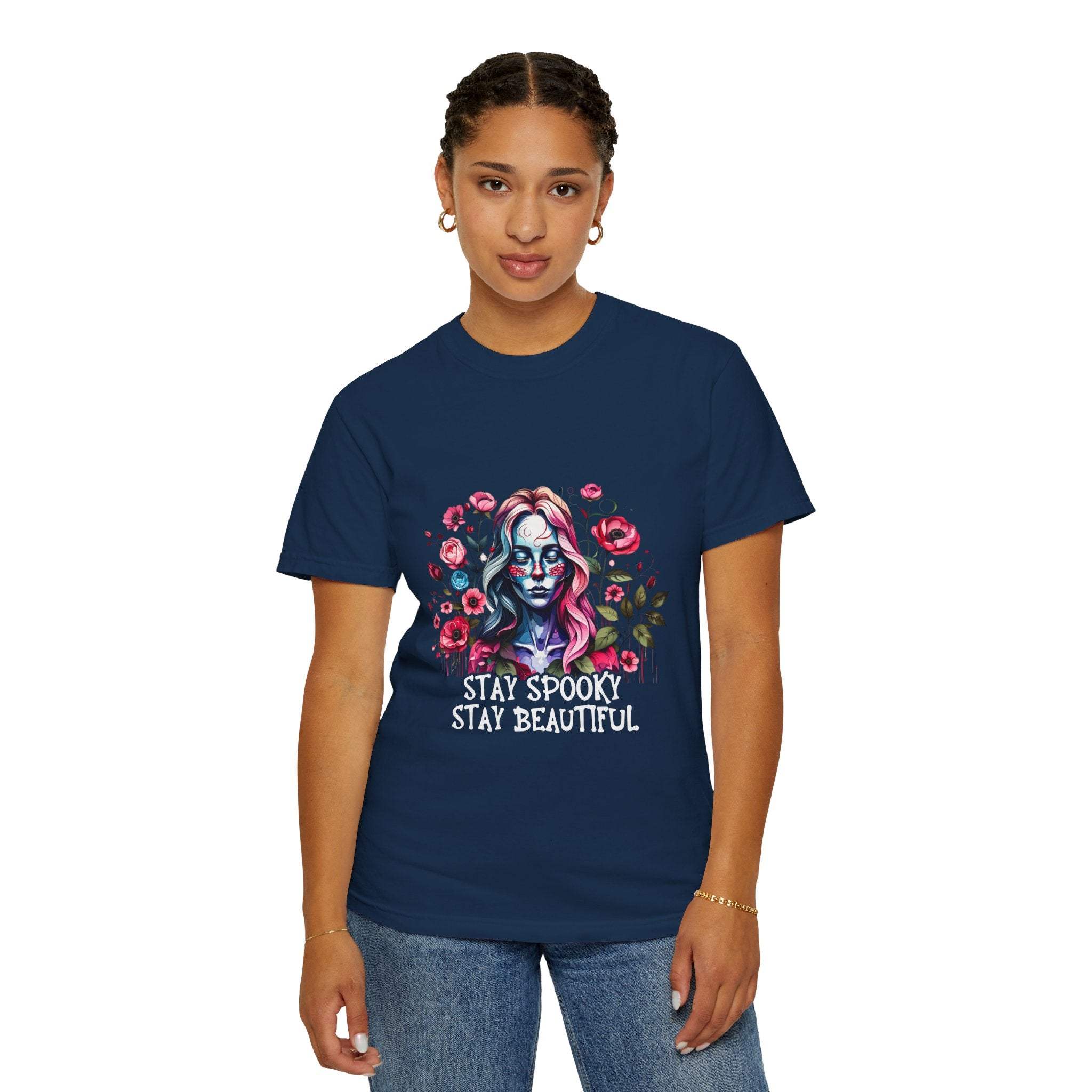 Woman wearing navy floral skeleton t-shirt with "Stay Spooky Stay Beautiful" text and floral skull design