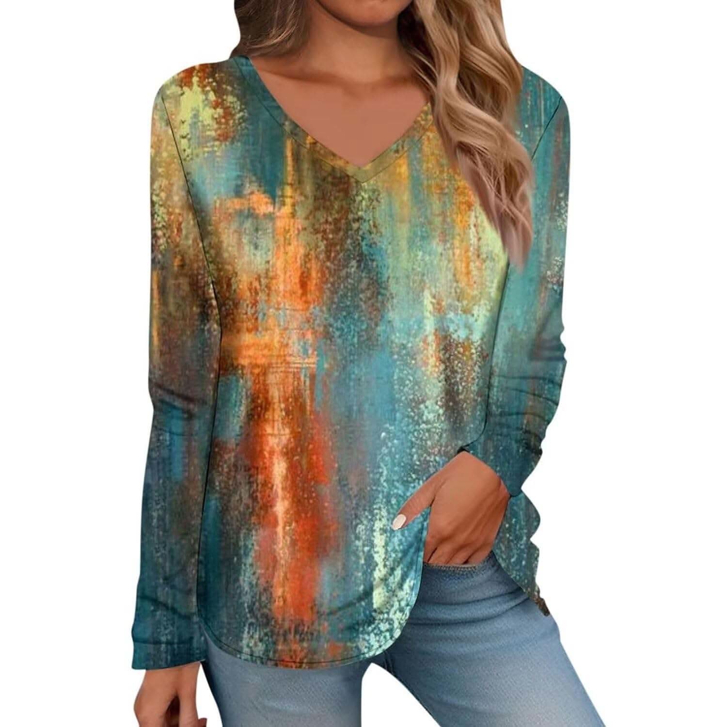 Woman wearing a Tropical Boho Floral V-Neck Tee with vibrant floral patterns and a relaxed fit