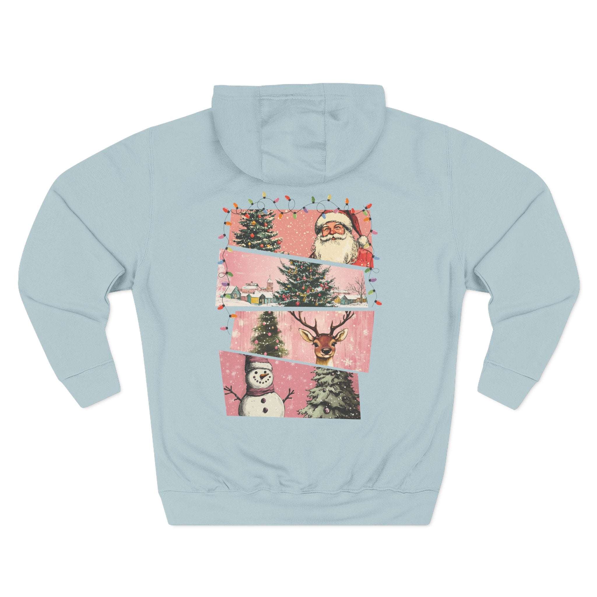 Light blue fleece hoodie with festive pink watercolor holiday design featuring Santa, Christmas trees, snowman, and reindeer