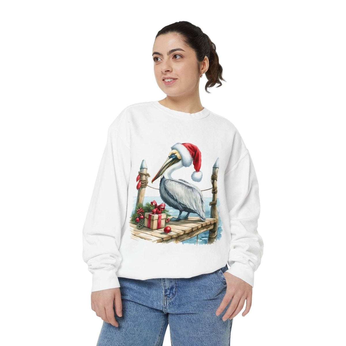 Woman wearing white Christmas Pelican Santa Sweatshirt with festive pelican design and red Santa hat