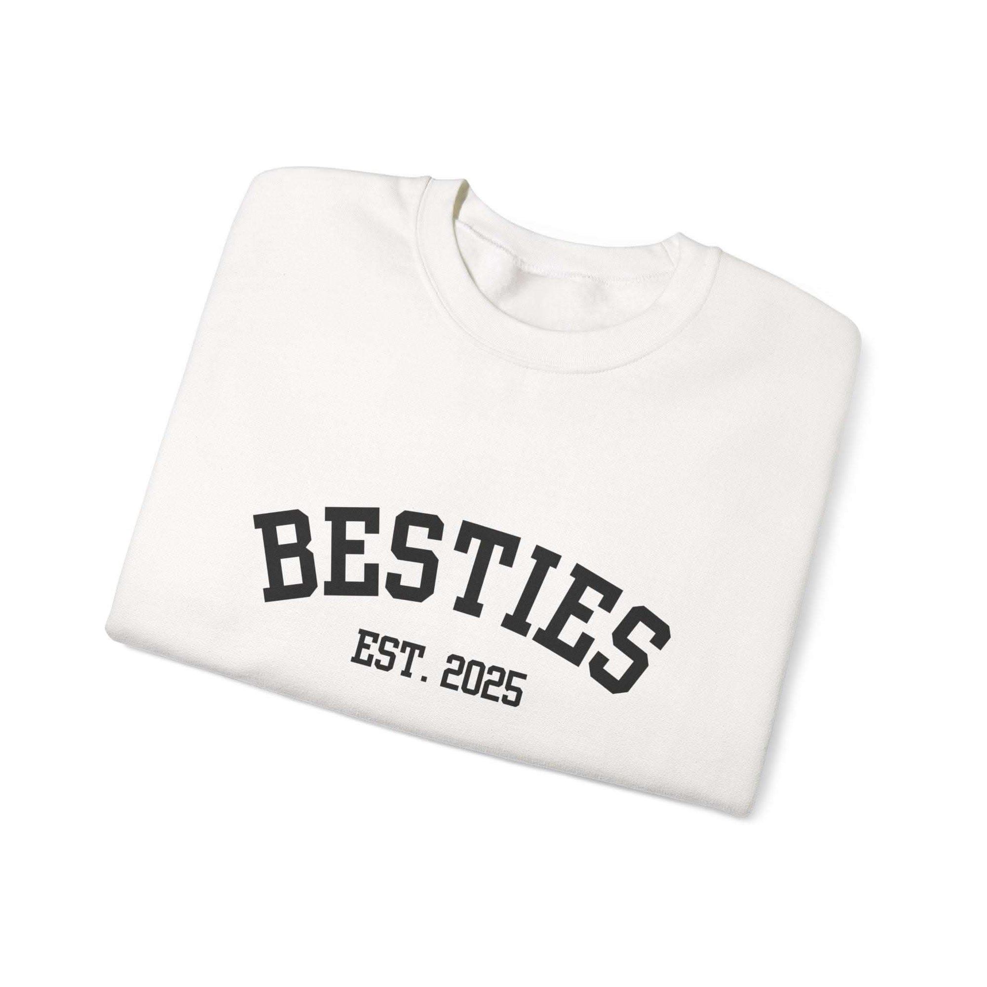 White sweatshirt with 'BESTIES EST. 2025' text on a white background