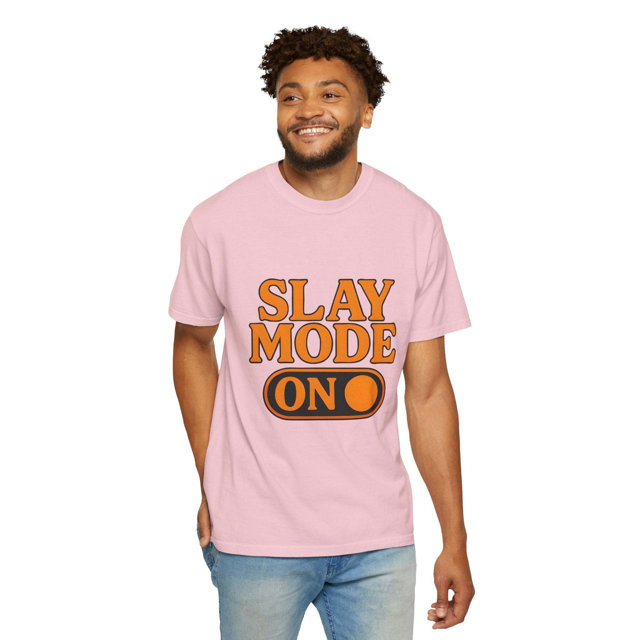 Man wearing pink garment-dyed tee with "Slay Mode On" text in orange and black