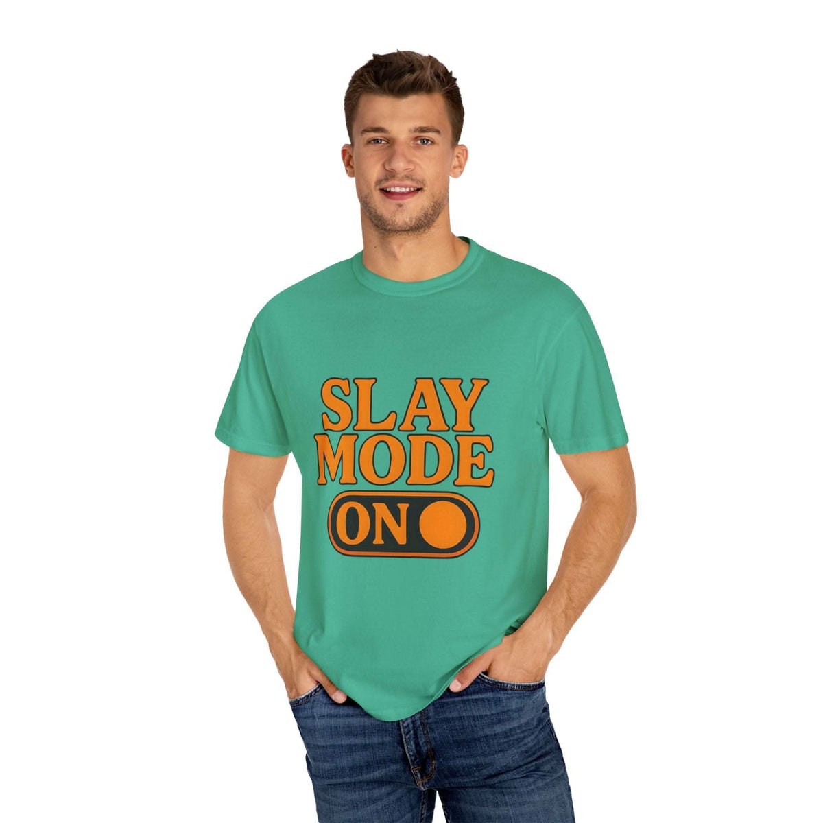 Man wearing green garment-dyed tee with "Slay Mode On" text in bold orange letters