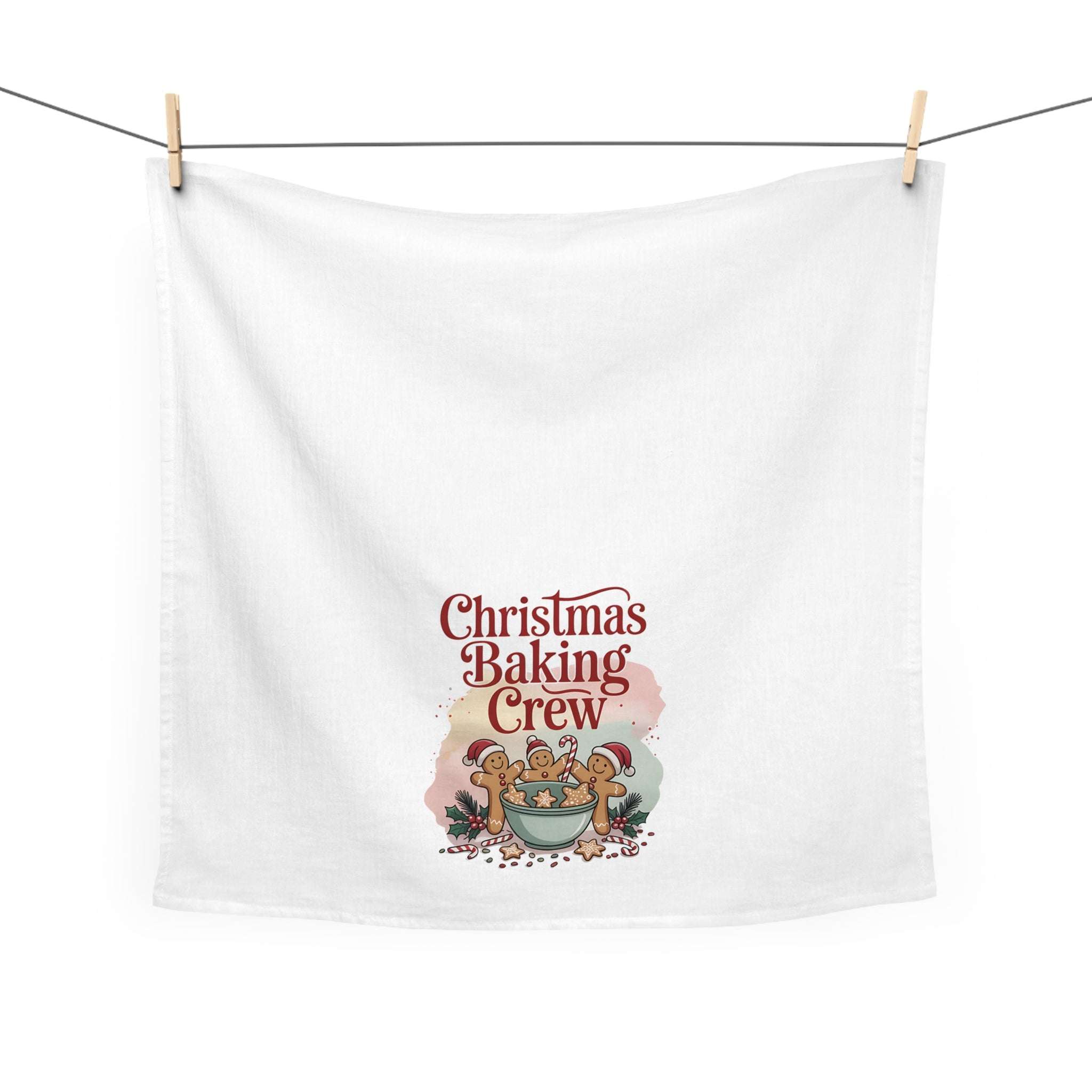 White cotton tea towel featuring 'Christmas Baking Crew' design, ideal for festive kitchen decor