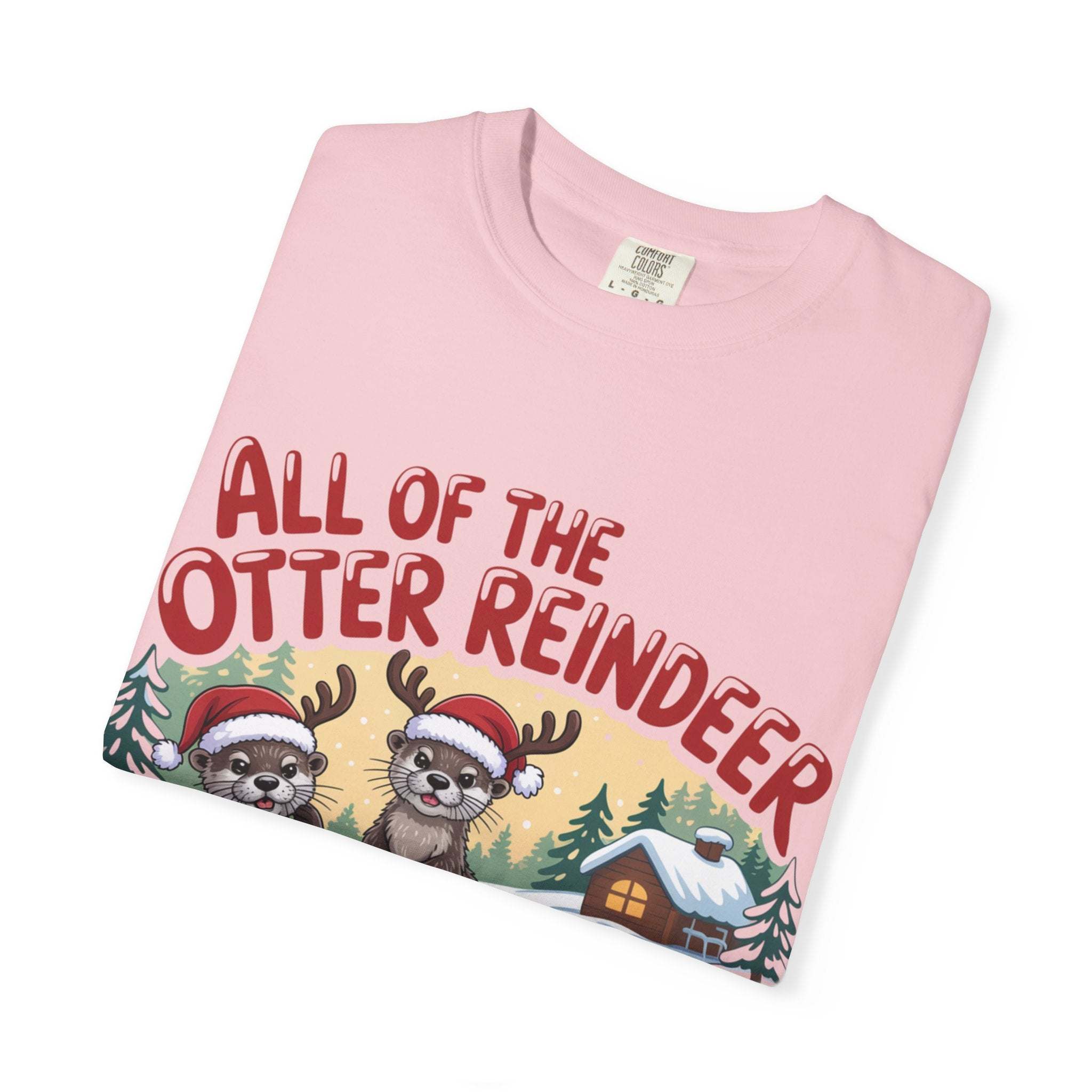 Pink Otter Reindeer Tee with festive otter illustration wearing Santa hats and reindeer antlers, holiday design
