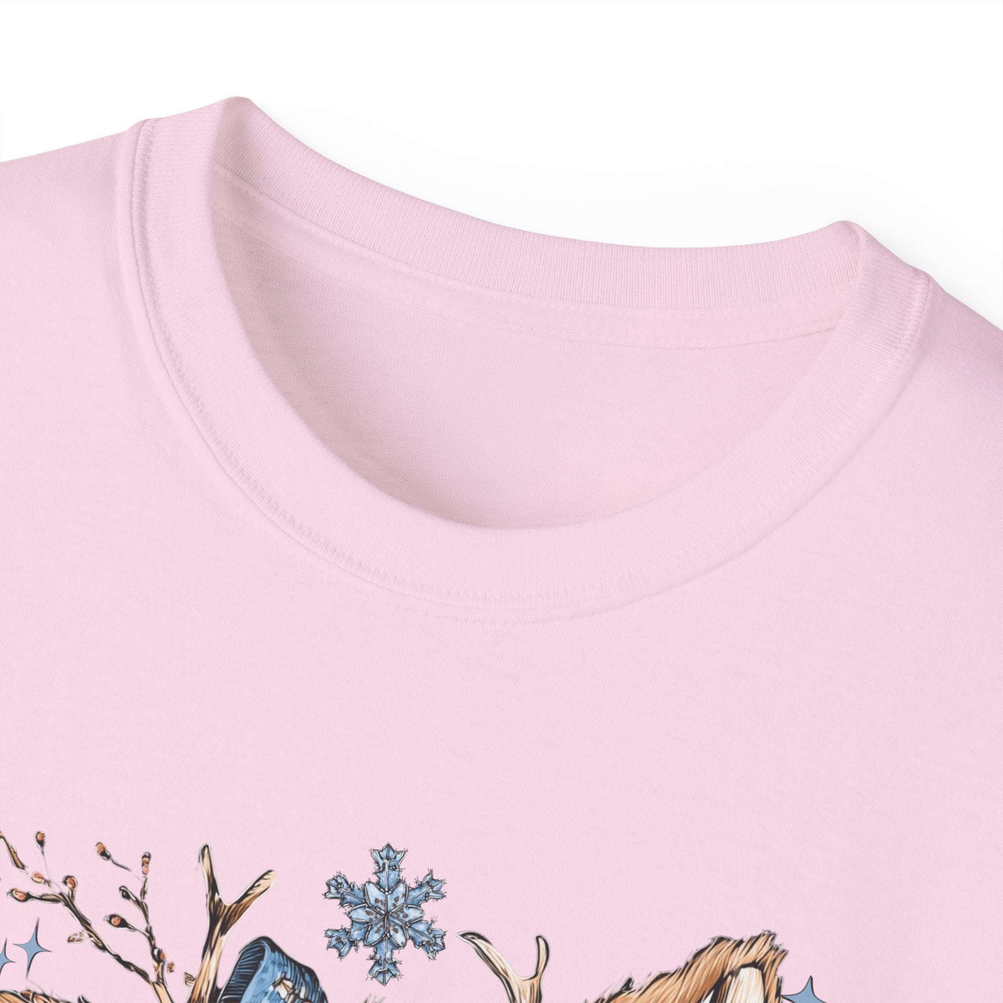 White t-shirt with retro patchwork reindeer design wearing blue scarf and surrounded by snowflakes