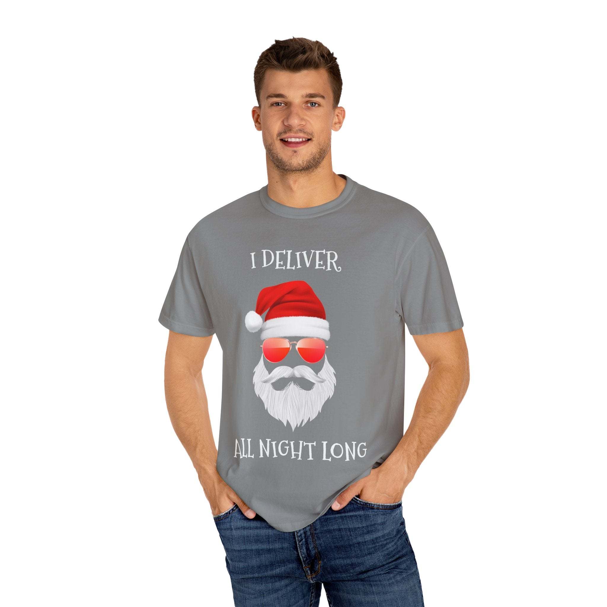 Man wearing gray Santa I Deliver All Night Long Christmas themed T-shirt with Santa face and red sunglasses