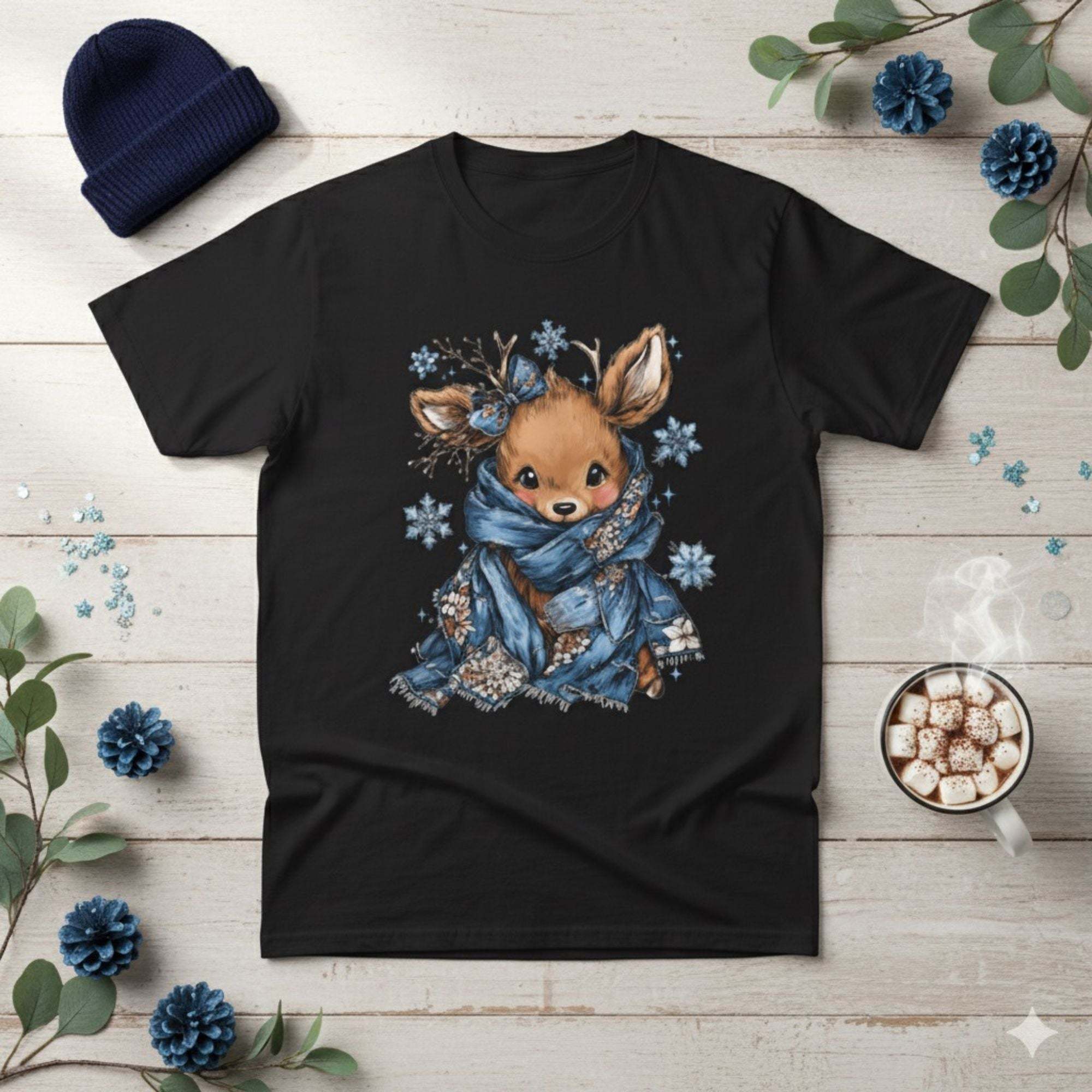 Black Retro Patchwork Reindeer T-shirt with blue scarf and snowflake design on wooden background with winter accessories