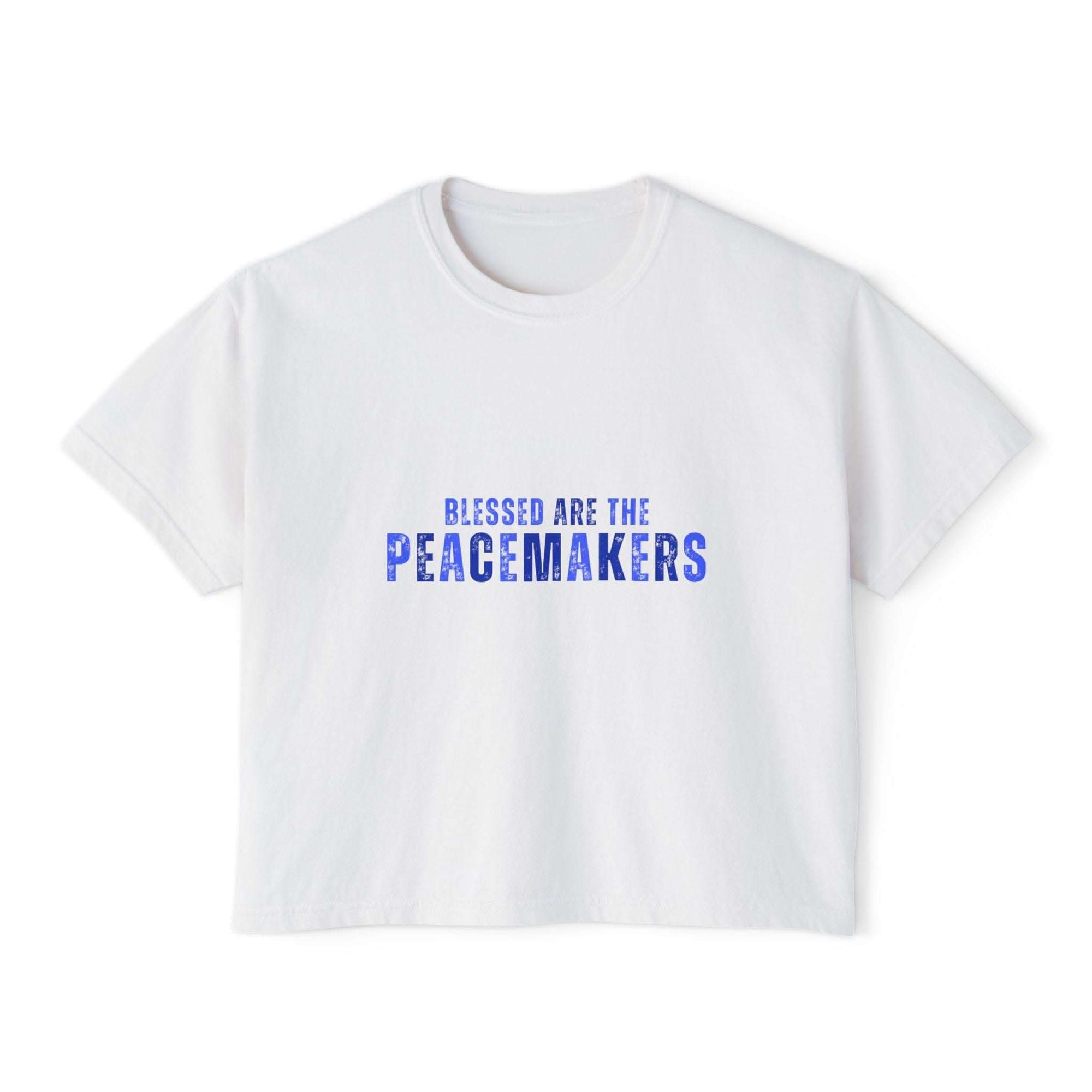 Women's white boxy tee with "Blessed be the Peacemakers" text in blue, casual and vintage style