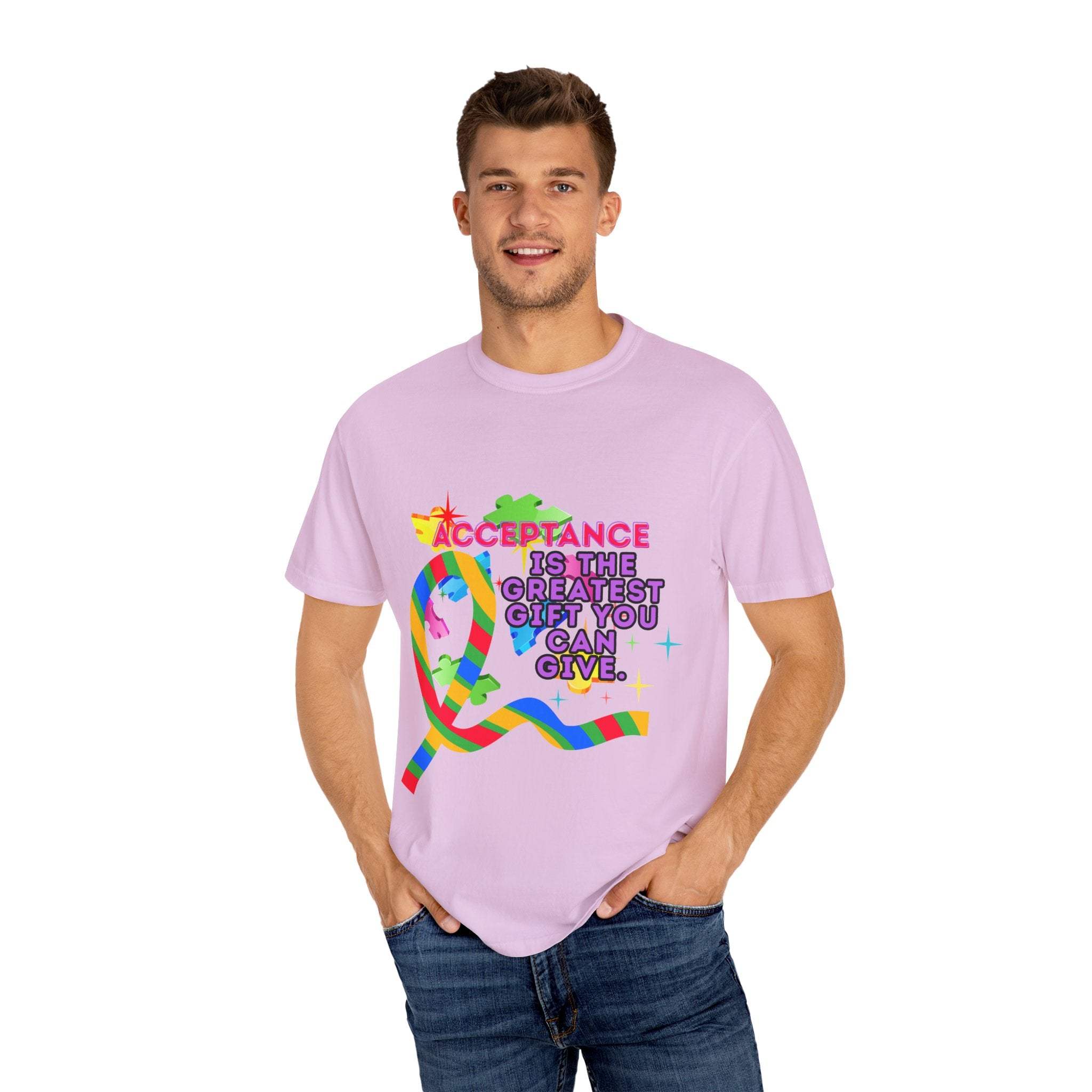 Man wearing pink garment-dyed T-shirt with colorful autism acceptance ribbon and message promoting inclusivity