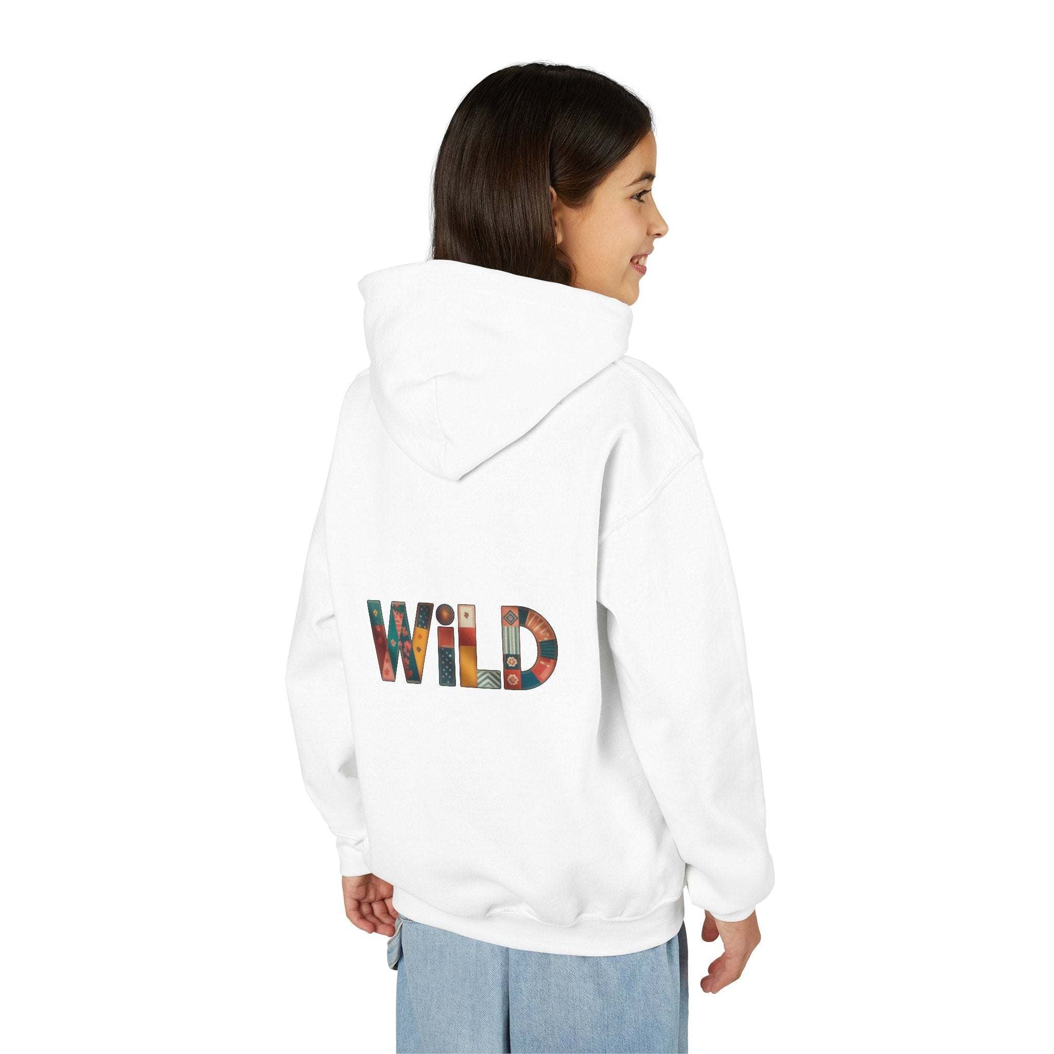 Child wearing white Patchwork Wild Word Hoodie with colorful "WILD" text on back and hood up