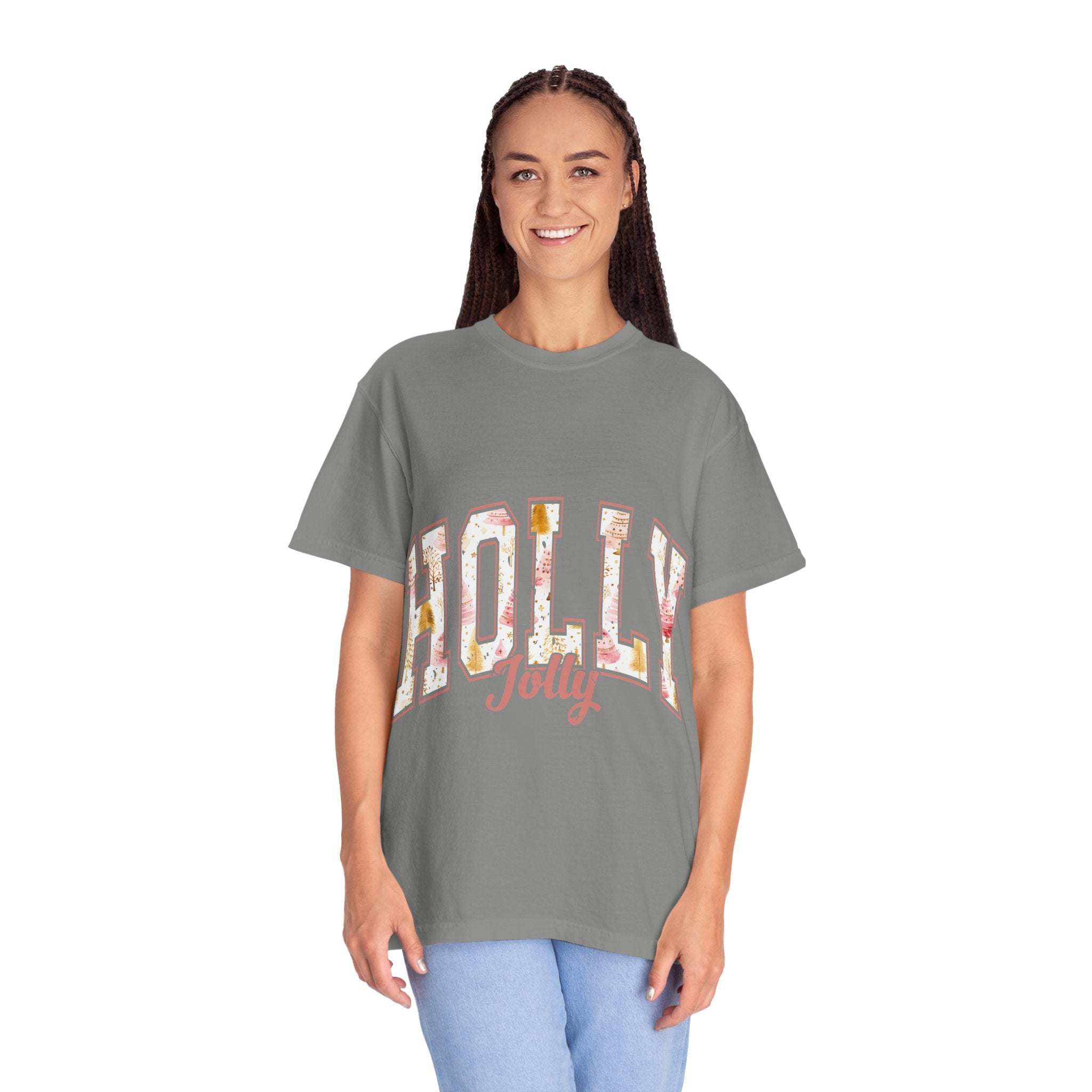 Woman wearing a gray Varsity Holly Jolly T-shirt with festive lettering and relaxed fit