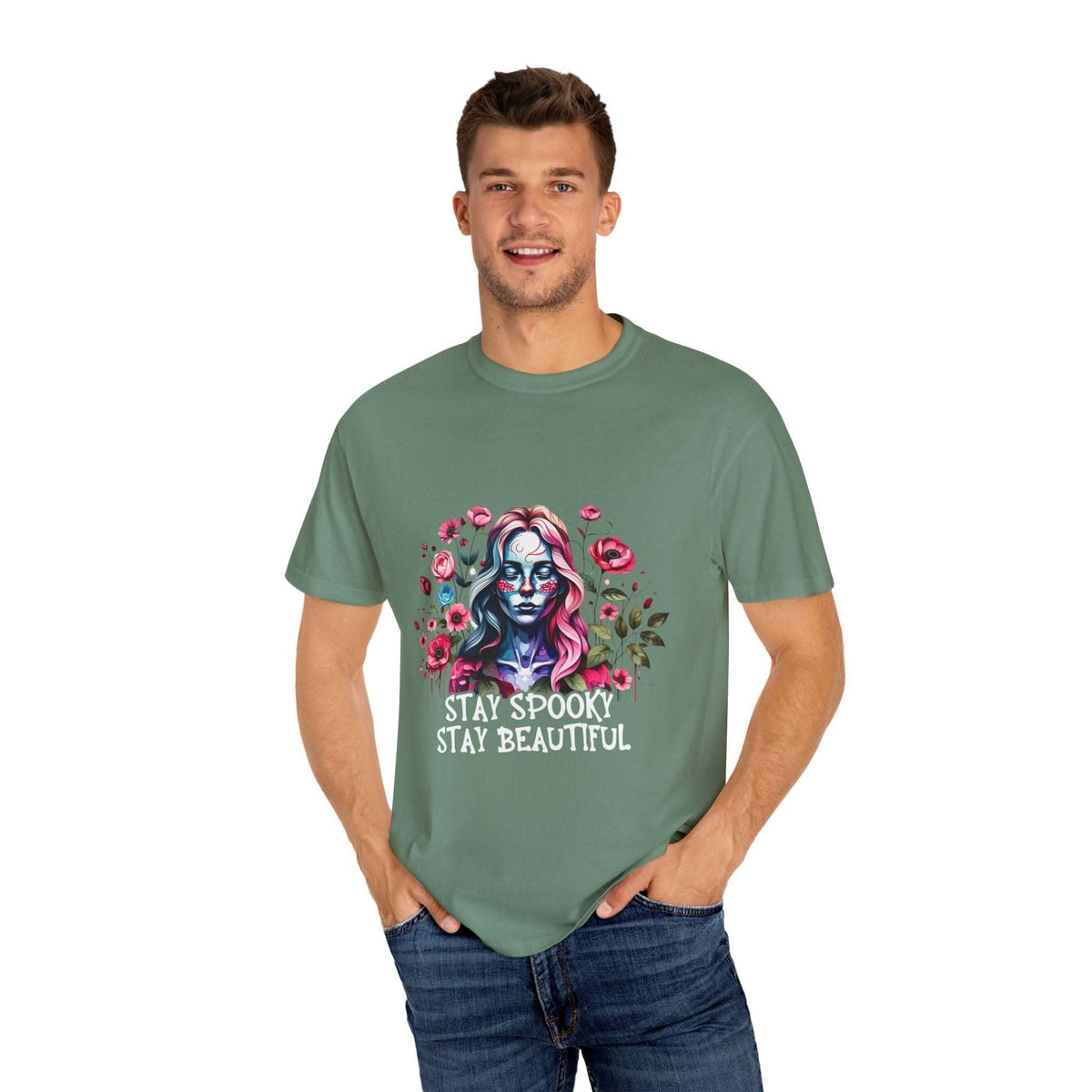Man wearing green floral skeleton t-shirt with "Stay Spooky Stay Beautiful" text and relaxed fit