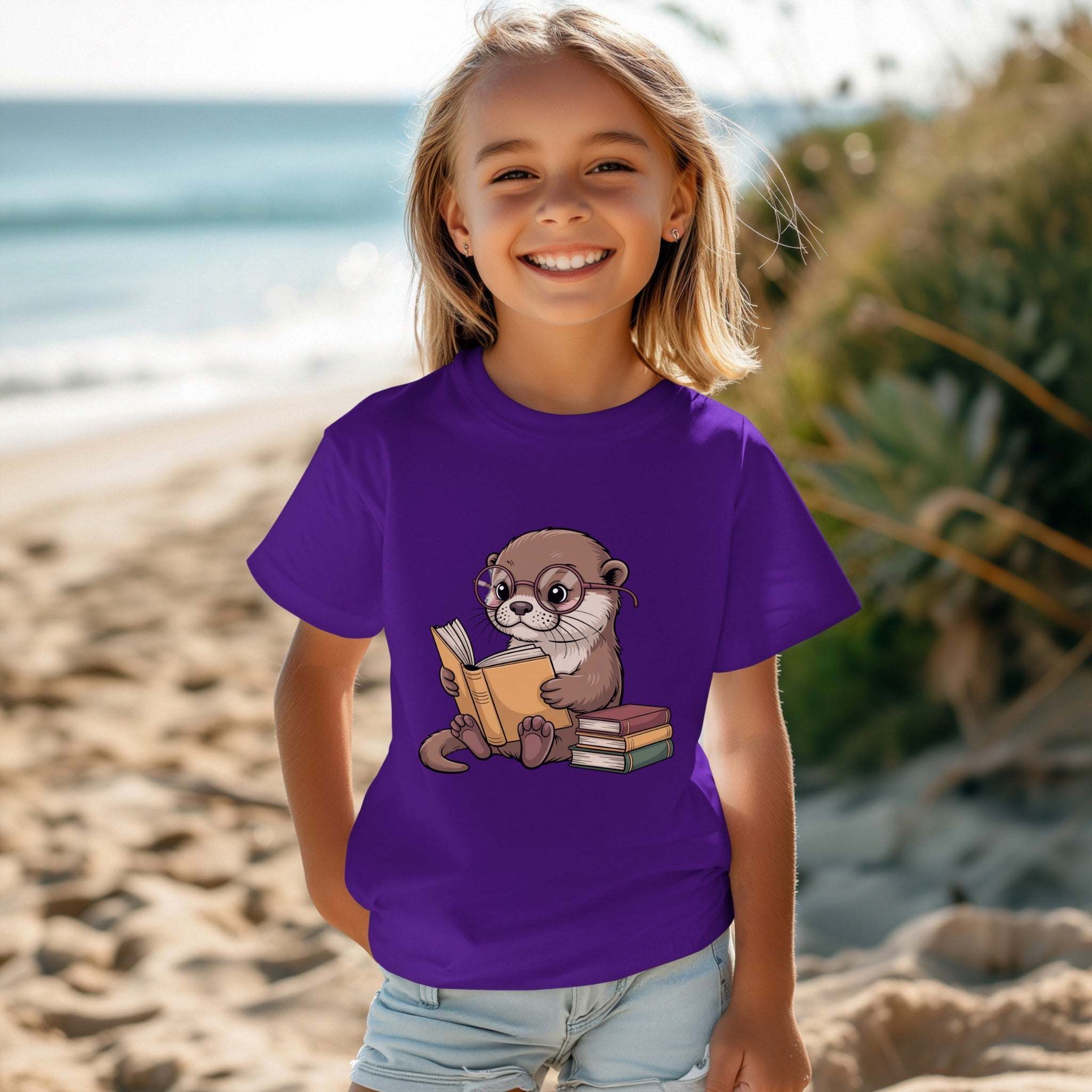 Youth tee featuring a reading otter design, soft and breathable for kids.