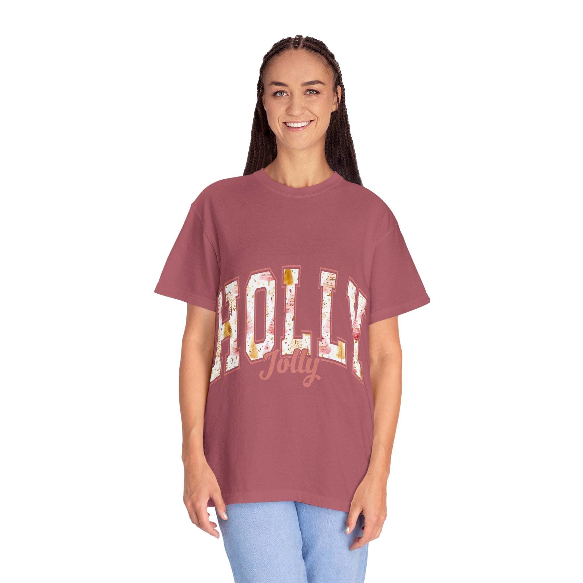 Woman wearing a maroon Varsity Holly Jolly T-shirt with festive text and relaxed fit
