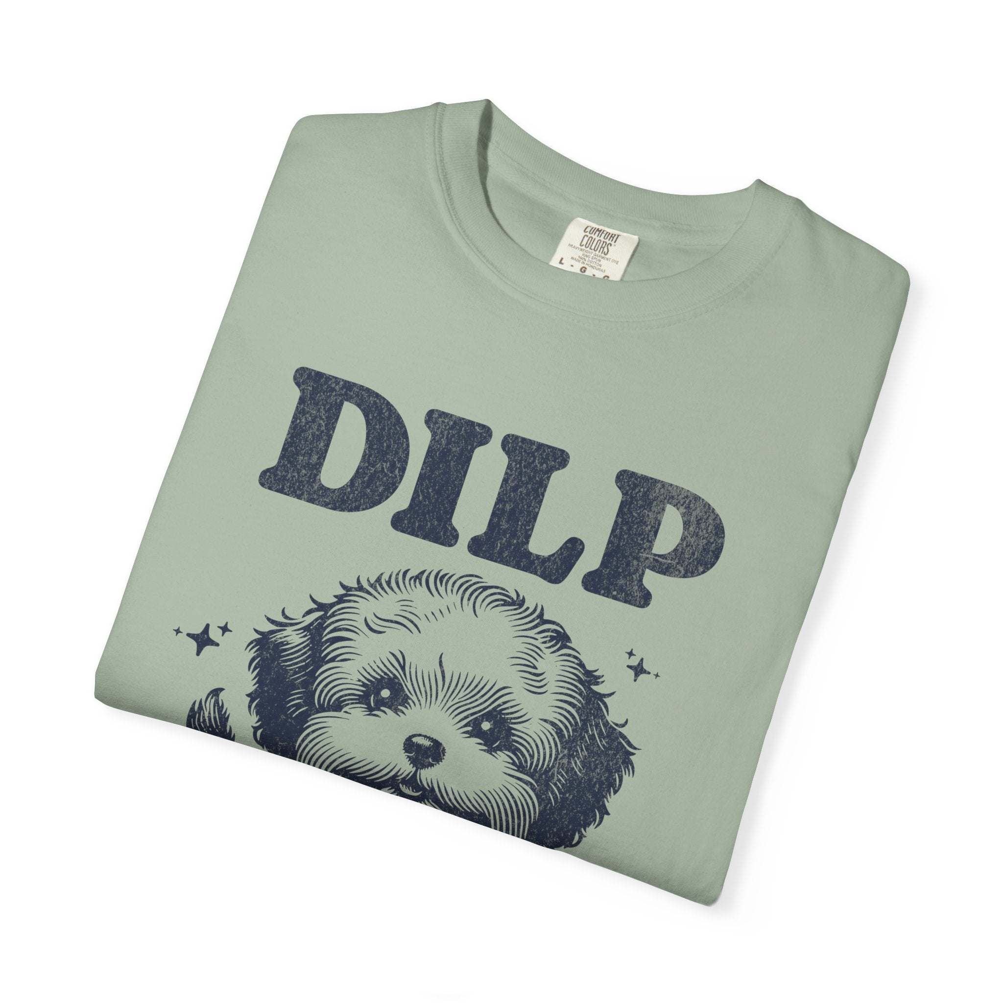 Garment-dyed T-shirt with playful dog illustration and DILP text in soft green color