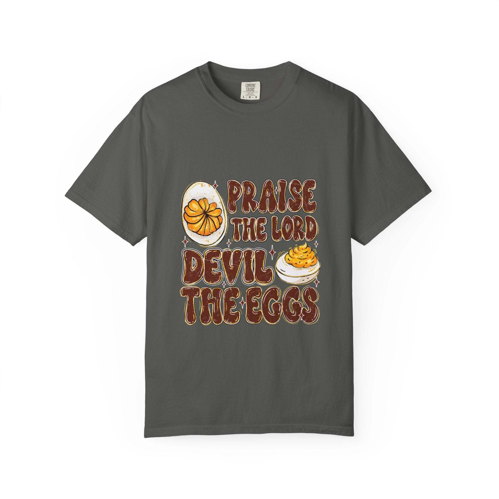 White cotton t-shirt featuring 'Praise the Lord, Devil the Eggs' graphic, suitable for Easter and everyday wear.