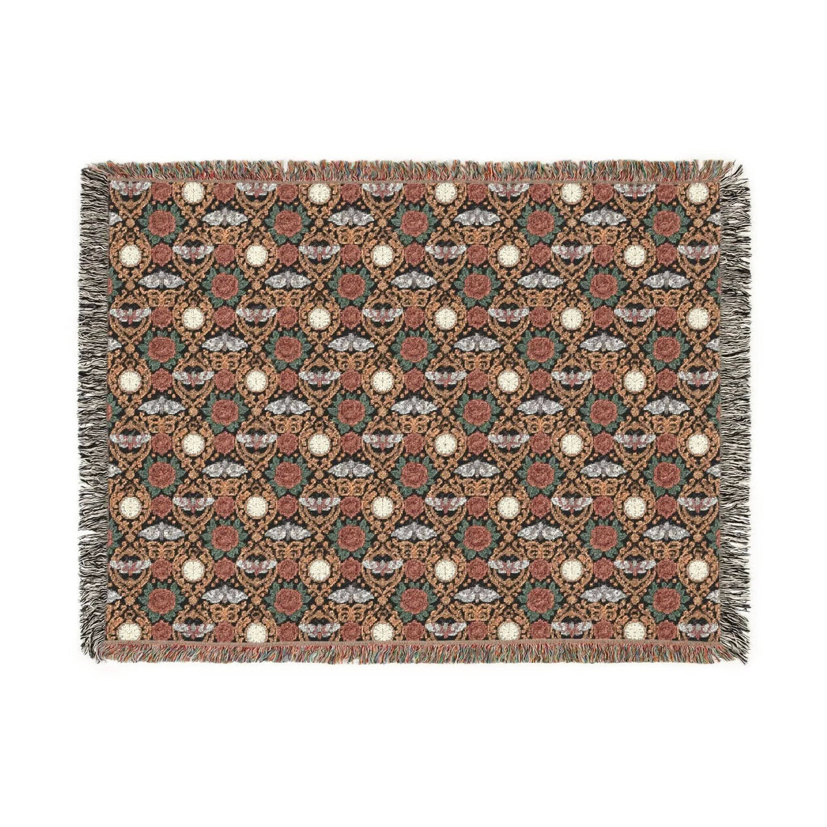 Victorian Gothmas Woven Blanket with candlelight colors and colorful fringed edges draped on a dark velvet bed
