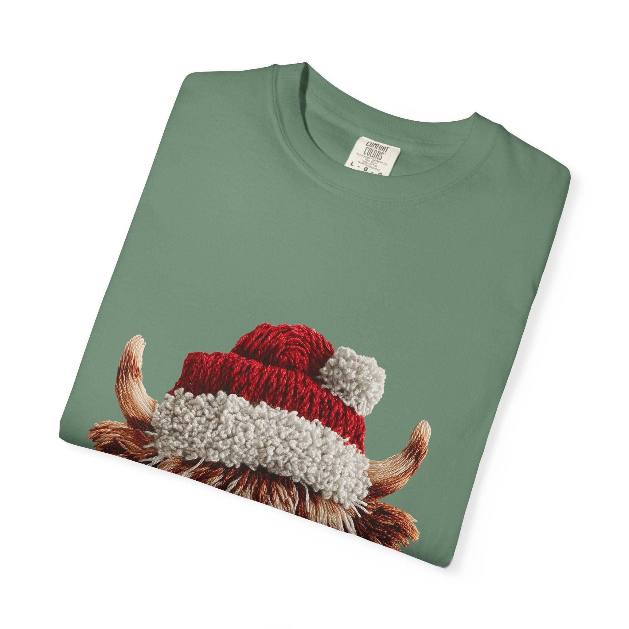 Green t-shirt with faux crochet yarn highland cow wearing Santa hat print