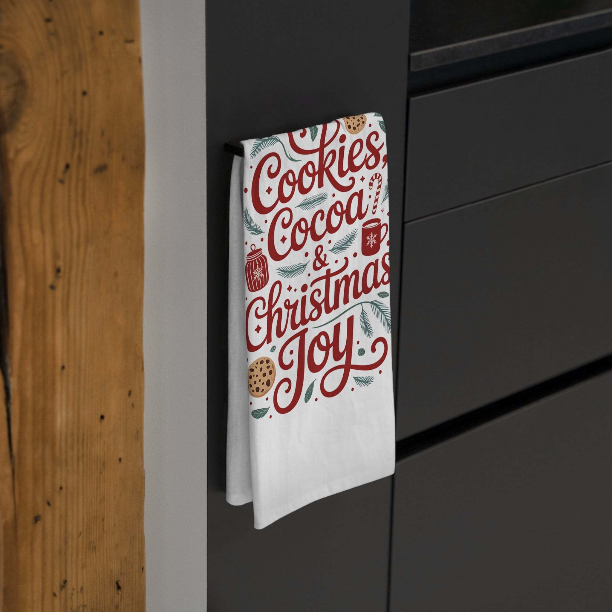 Festive cotton tea towel with Cookies, Cocoa, and Christmas Joy design hanging in kitchen