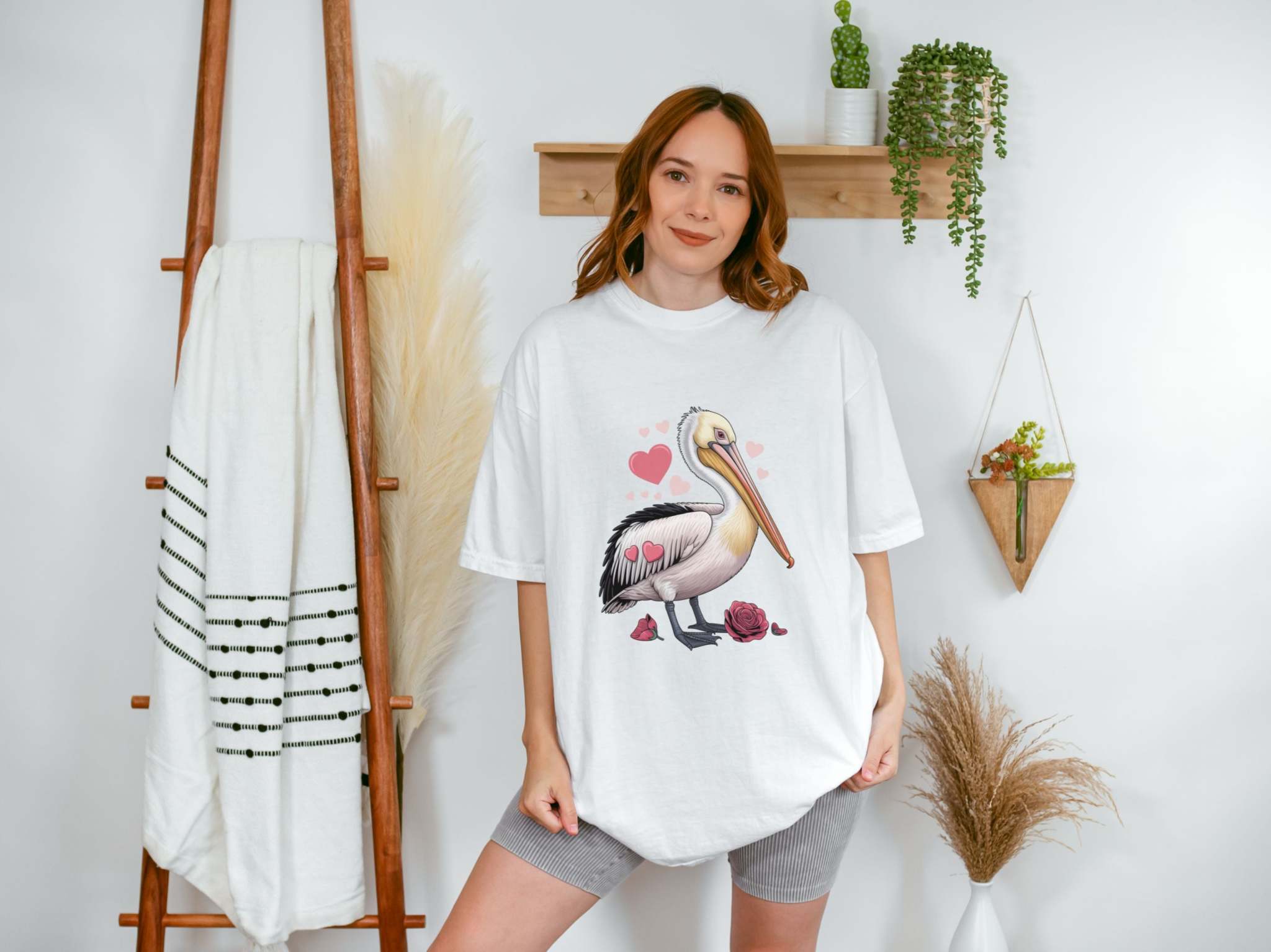 Valentine's Pelican Hearts T-Shirt in black, casual beach style, perfect gift for her, by Printify.