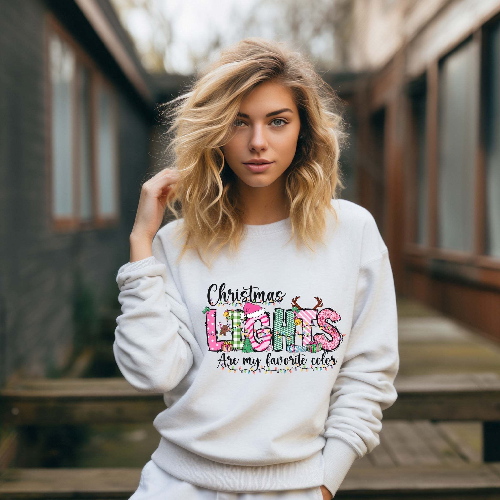 Woman wearing white Christmas Lights garment-dyed sweatshirt with festive holiday print outdoors