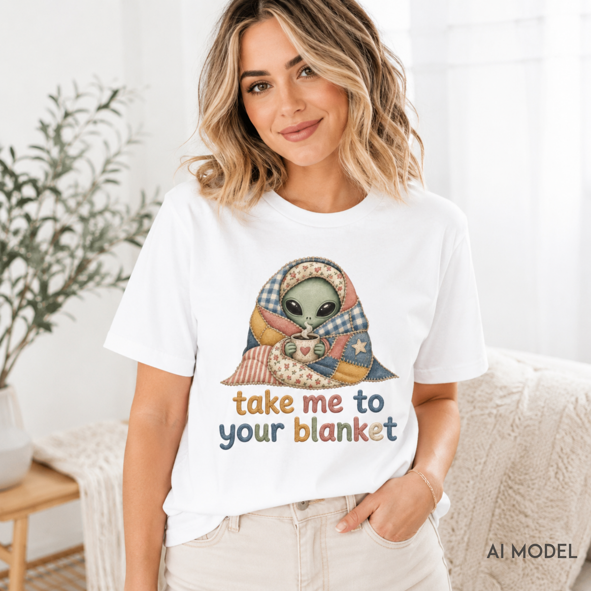 Alien in Blanket T-Shirt with vintage-washed cozy graphic of alien wrapped in blanket holding mug and text "Take Me to Your Blanket"
