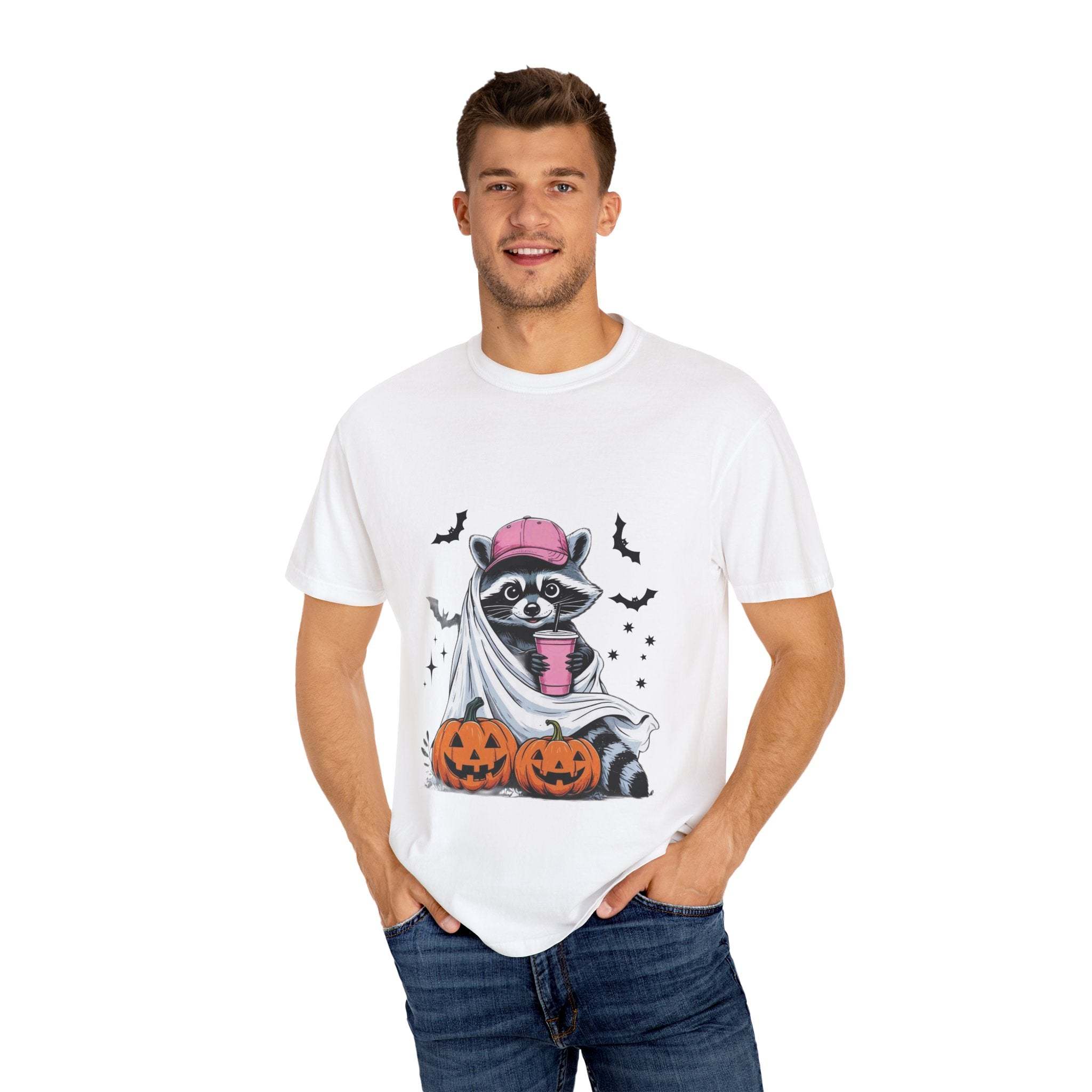Man wearing white Raccoon Ghost Halloween T-shirt with raccoon in ghost costume and pumpkins design