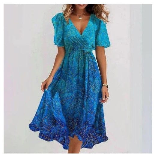Woman wearing elegant blue chiffon printed short sleeve V-neck summer dress with mid-length skirt