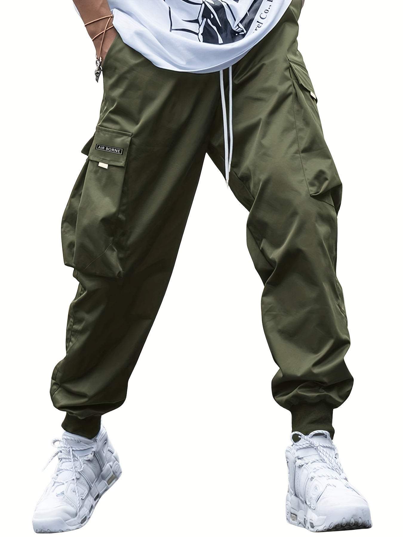 Men's casual multi-pocket cargo pants in olive green with drawstring waist and elastic cuffs, perfect for streetwear and outdoor sports.