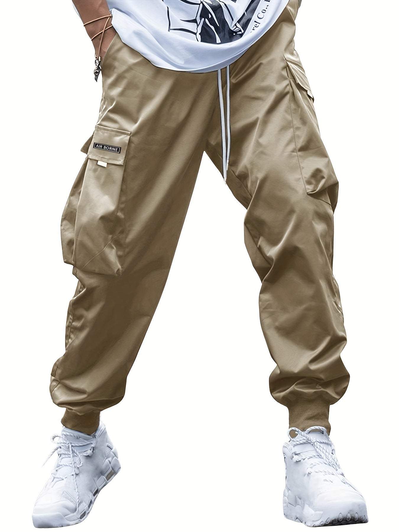 Men's beige multi-pocket cargo pants with drawstring waist, casual hip-hop style, loose fit, and elastic cuffs for outdoor and streetwear sports.