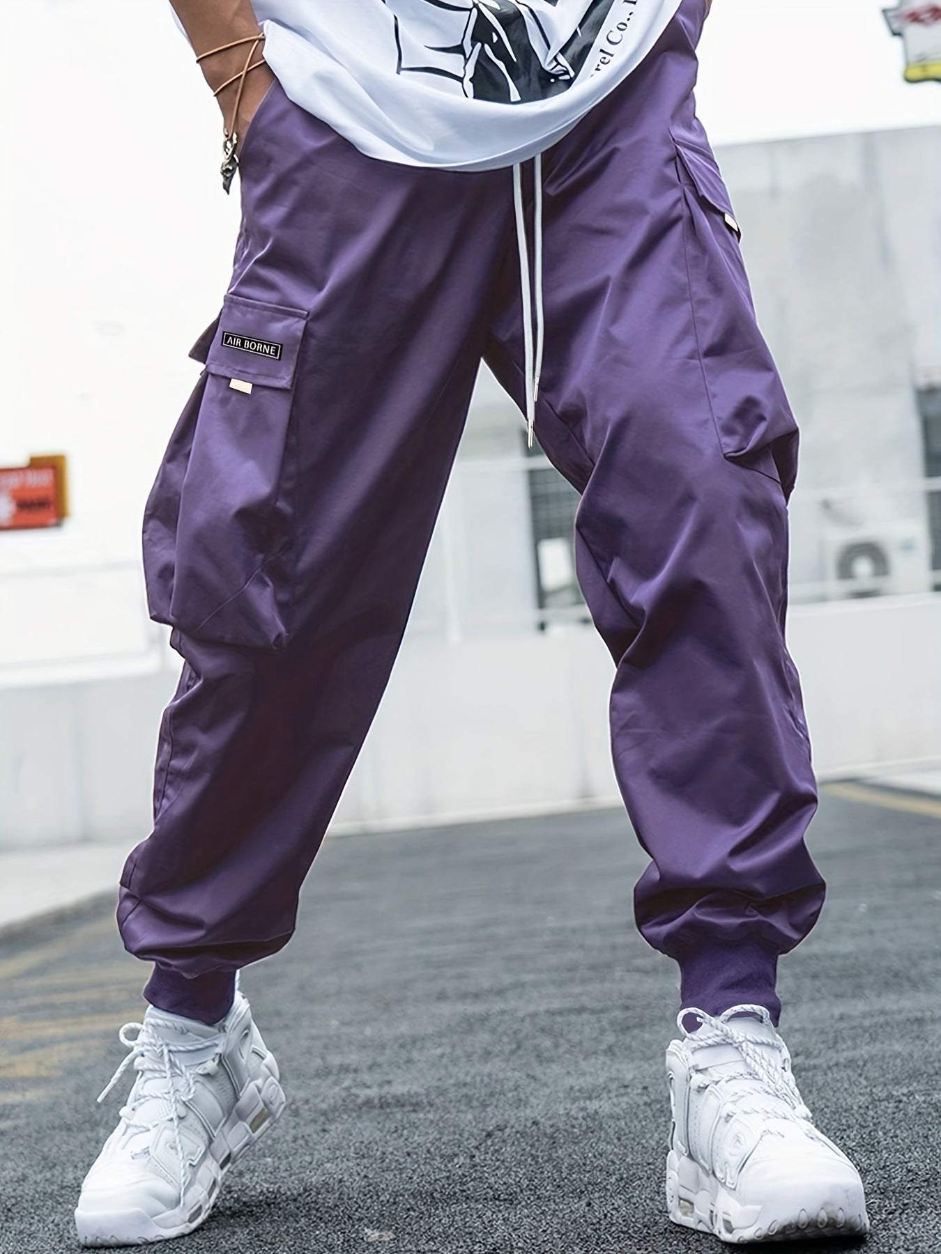 Men's casual hip-hop multi-pocket cargo pants in purple with drawstring waist and loose fit design