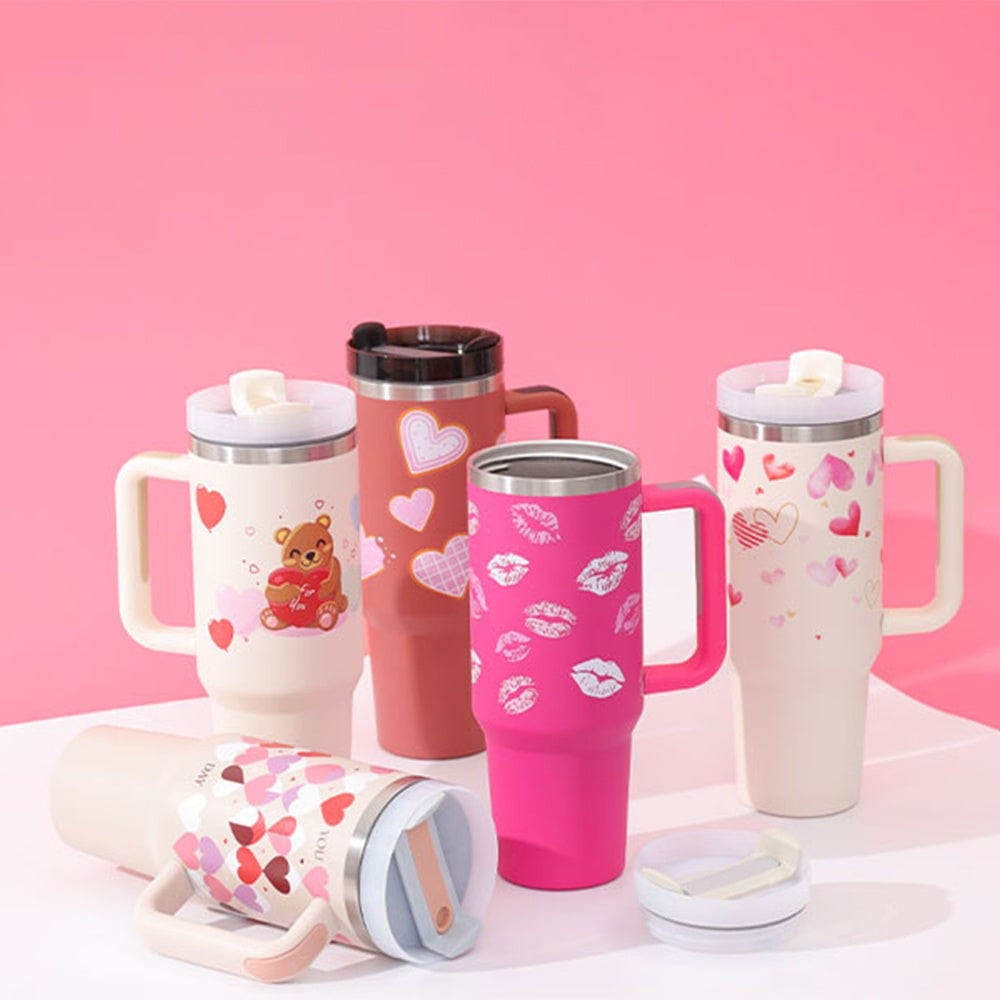 40oz insulated stainless steel tumbler with handle and straw featuring Valentine's Day themed heart and kiss prints in various colors