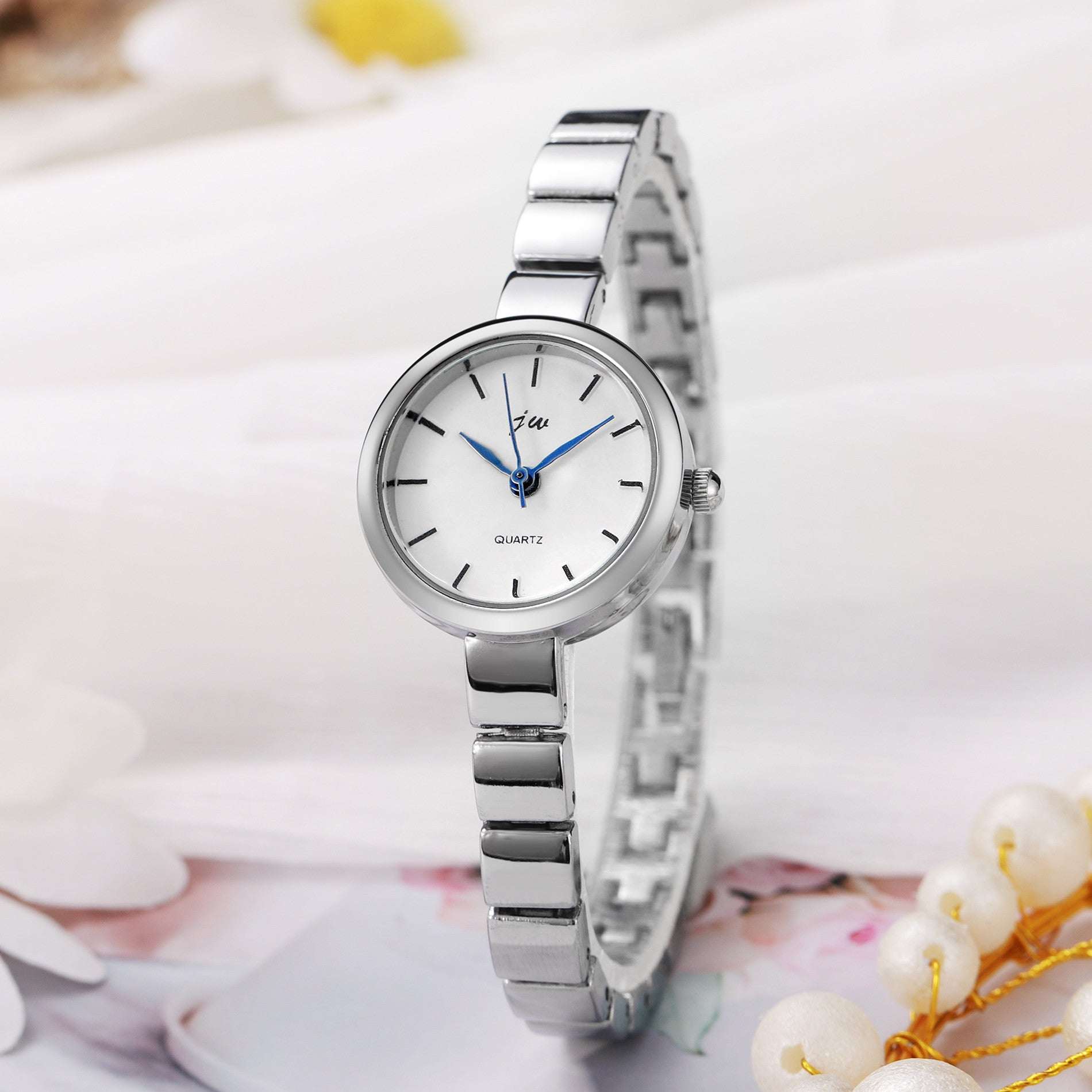 Silver Niche Steel Watch Women's with simple white round dial and metal strap