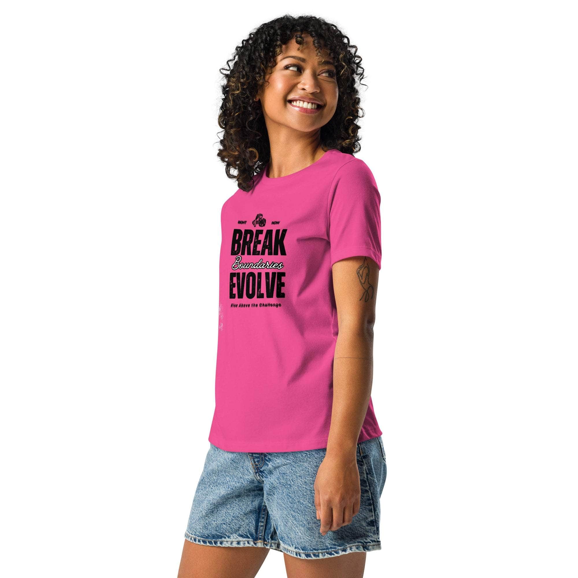 Woman wearing a pink Break Boundaries Evolve T-Shirt with motivational quote and denim shorts