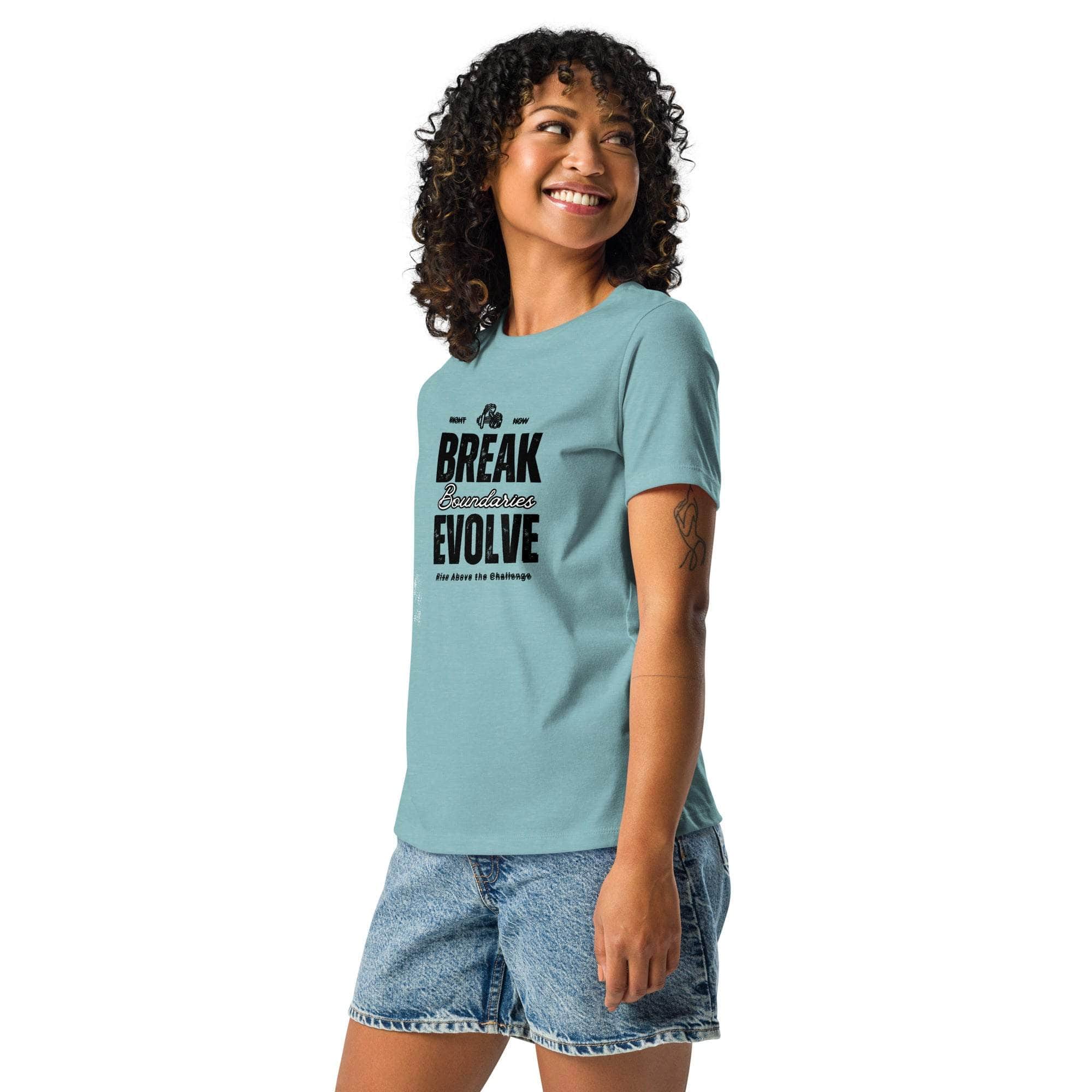 Woman wearing a light blue Break Boundaries Evolve T-Shirt with inspirational text paired with denim shorts