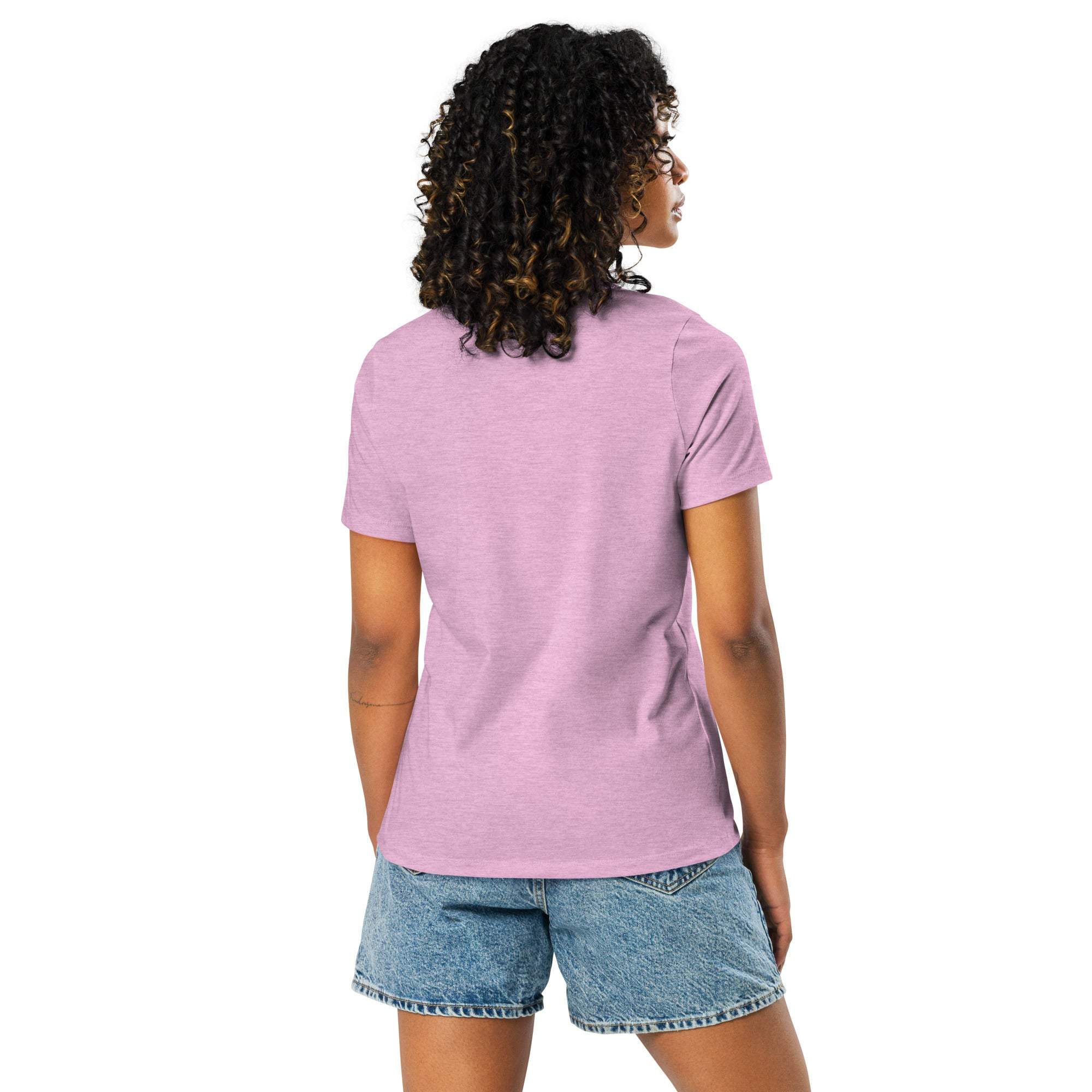 Woman wearing a light purple Break Boundaries Evolve T-Shirt with short sleeves and denim shorts, shown from the back.