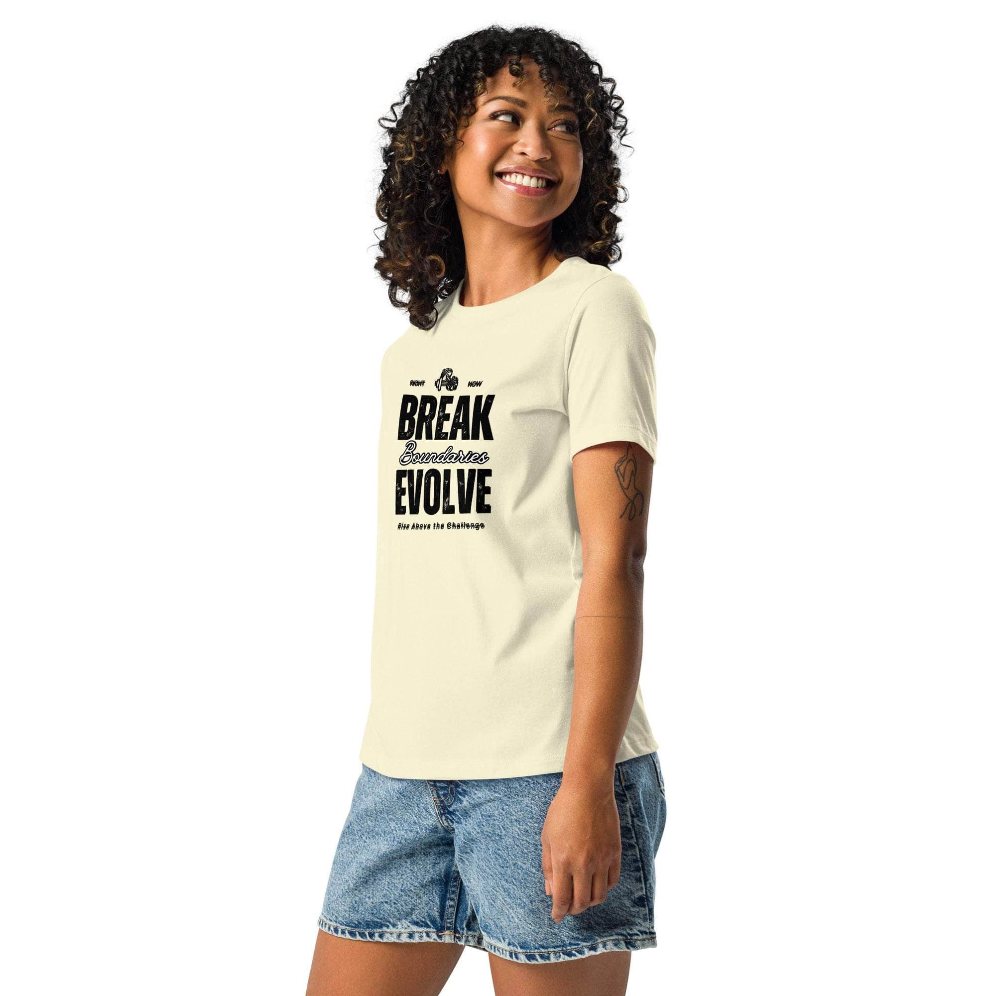 Woman wearing a beige Break Boundaries Evolve T-Shirt with motivational text paired with denim shorts