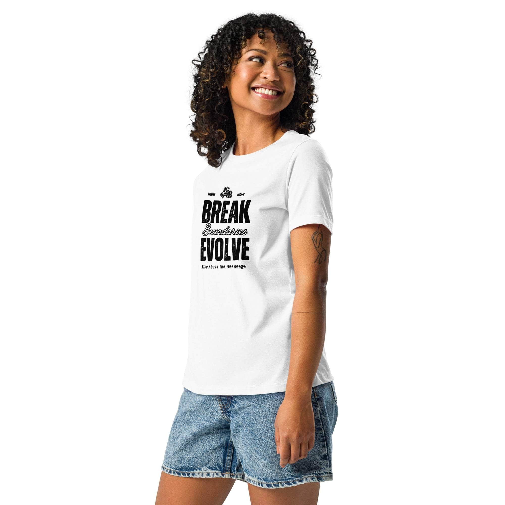 Woman wearing white Break Boundaries Evolve motivational quote t-shirt with denim shorts