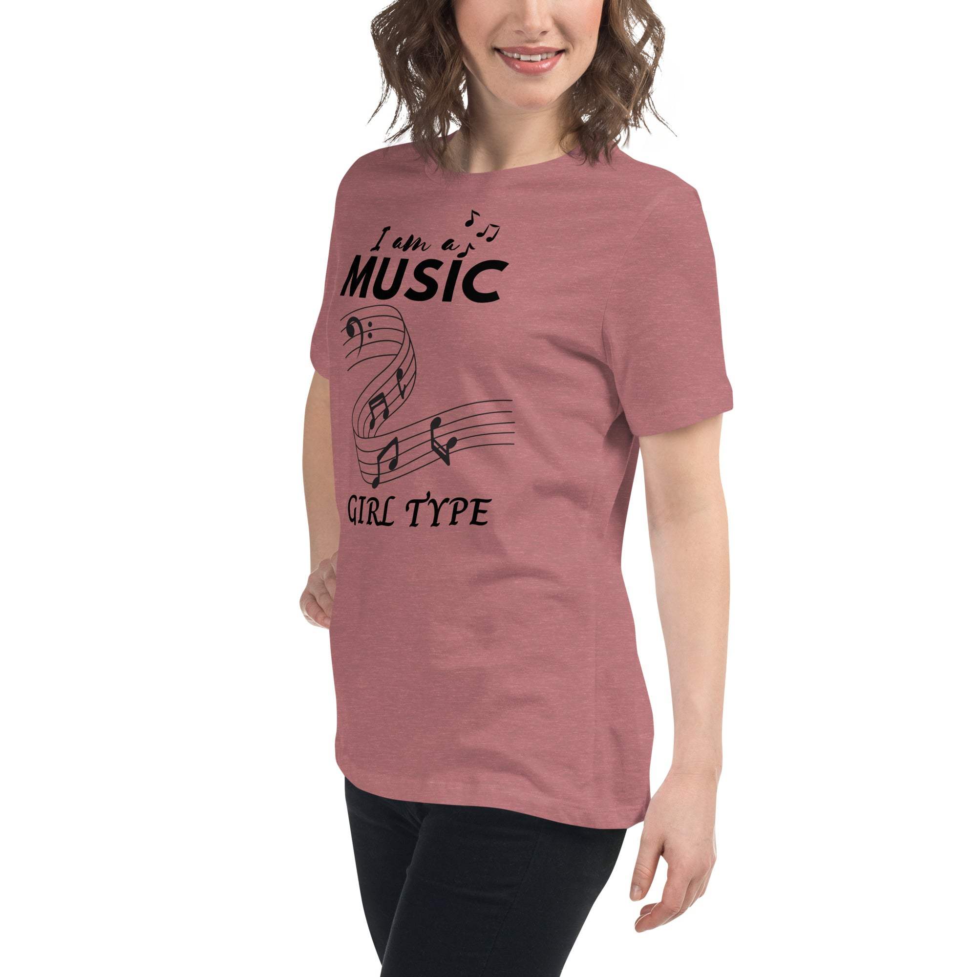 Woman wearing a soft pink Music Girl T-Shirt with playful musical notes graphic and text "I am a Music Girl Type"