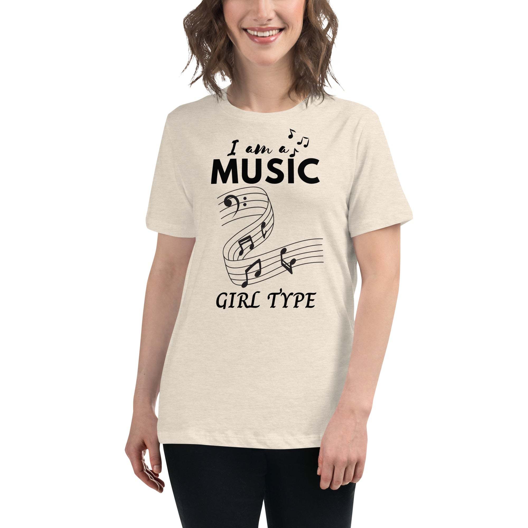 Woman wearing a beige Music Girl T-Shirt with black musical notes and text design, casual and comfortable fit