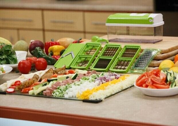 12pcs green food grate food chopper set with various blades and sliced vegetables on kitchen counter